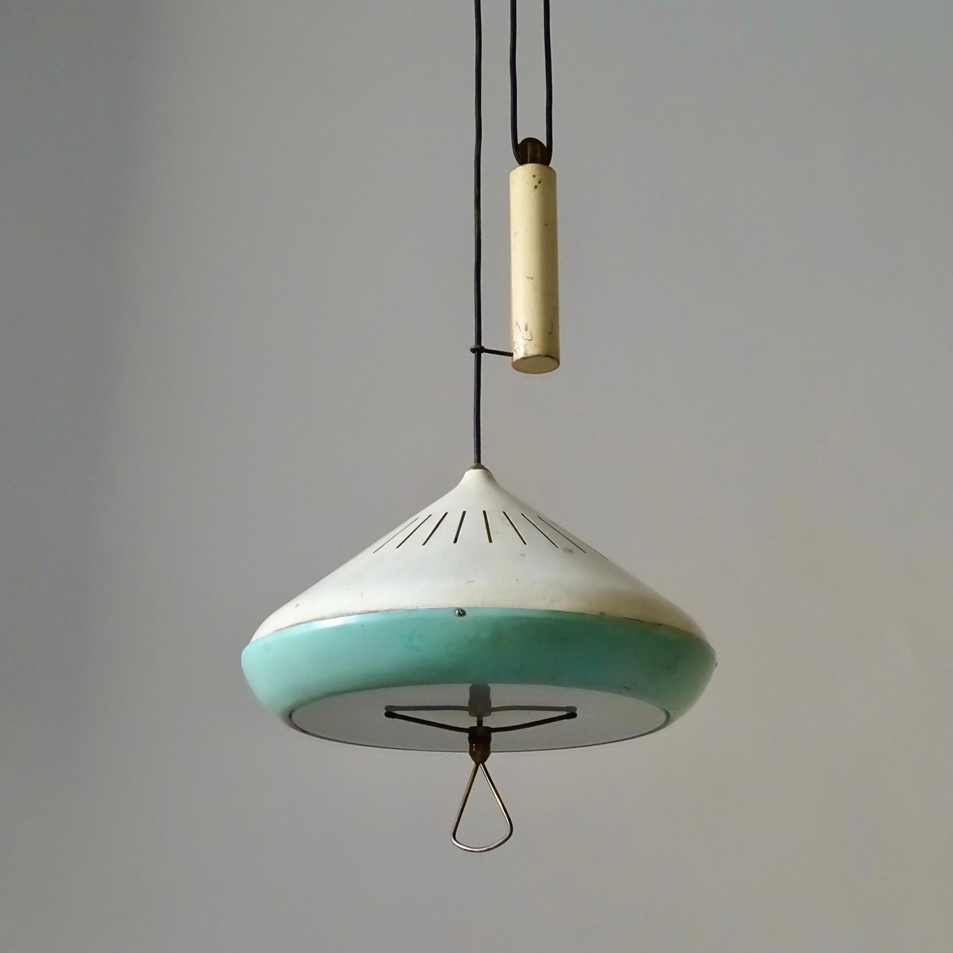White and blue lacquered Midcentury Modern pendant lamp with counterweight, designed and produced in Brazil in the 1950s. It features lacquered shade, weight and ceiling cap and brass fittings. On the underside it has a round glass to provide glare