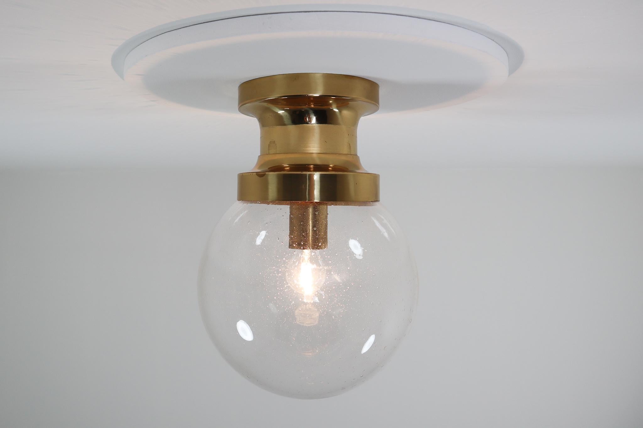 Large hotel ceiling light with brass frame and large hand blown glass. This light is beautifully thanks to the handblown glass and brass fixture. This light were originally founded at large hotel in Vienna, Austria. The pleasant light it spreads is