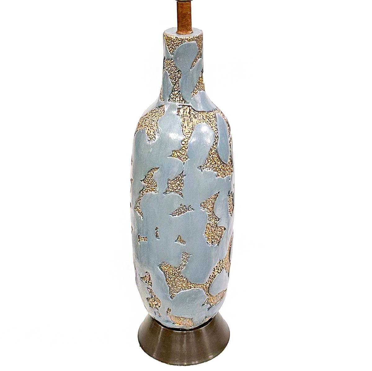 A circa 1960's Italian celadon color lamp with gilt details.

Measurements:
Height of body: 23
