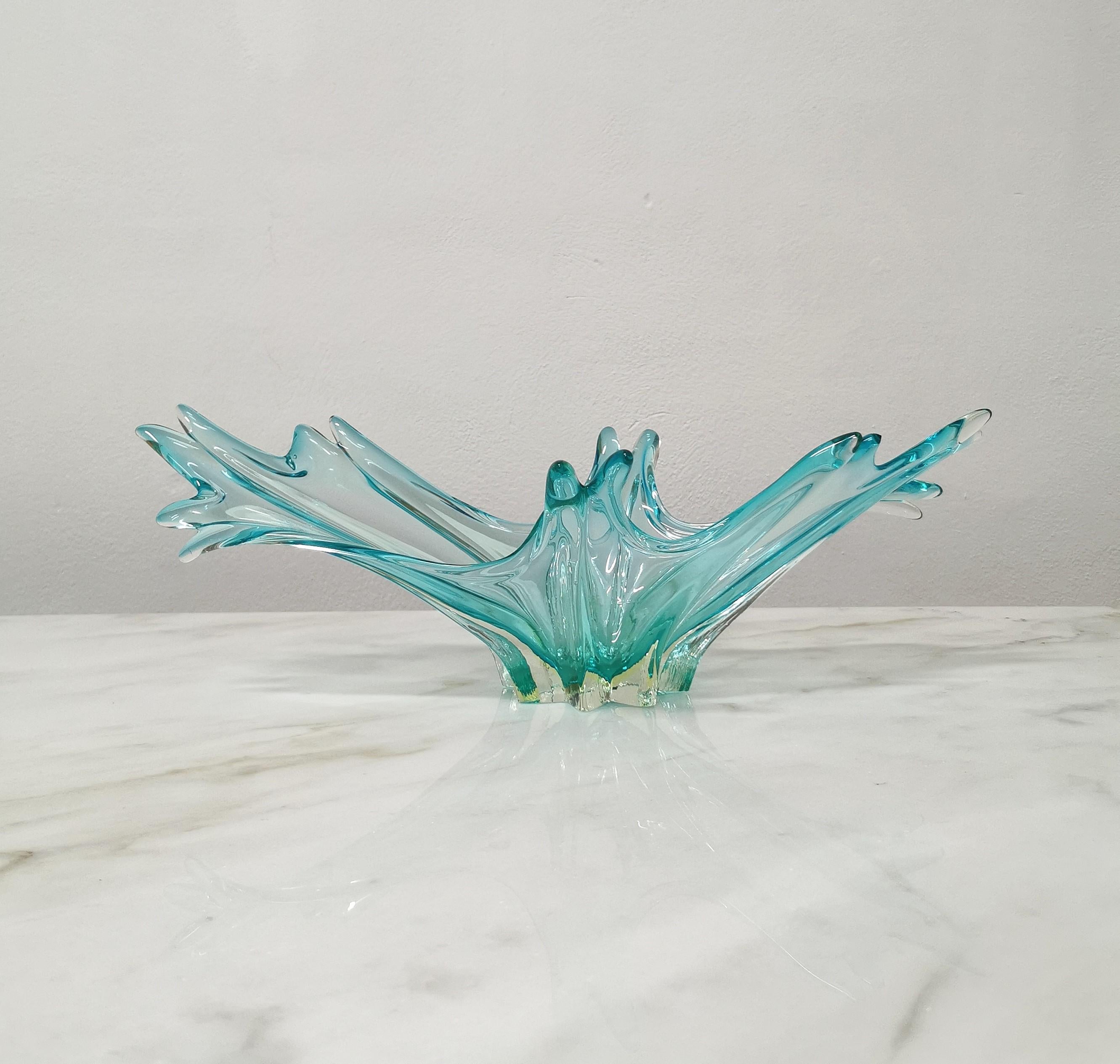 Centerpiece with particular shapes made of Murano glass in shades of teal and transparent. produced in Italy in the 70s.