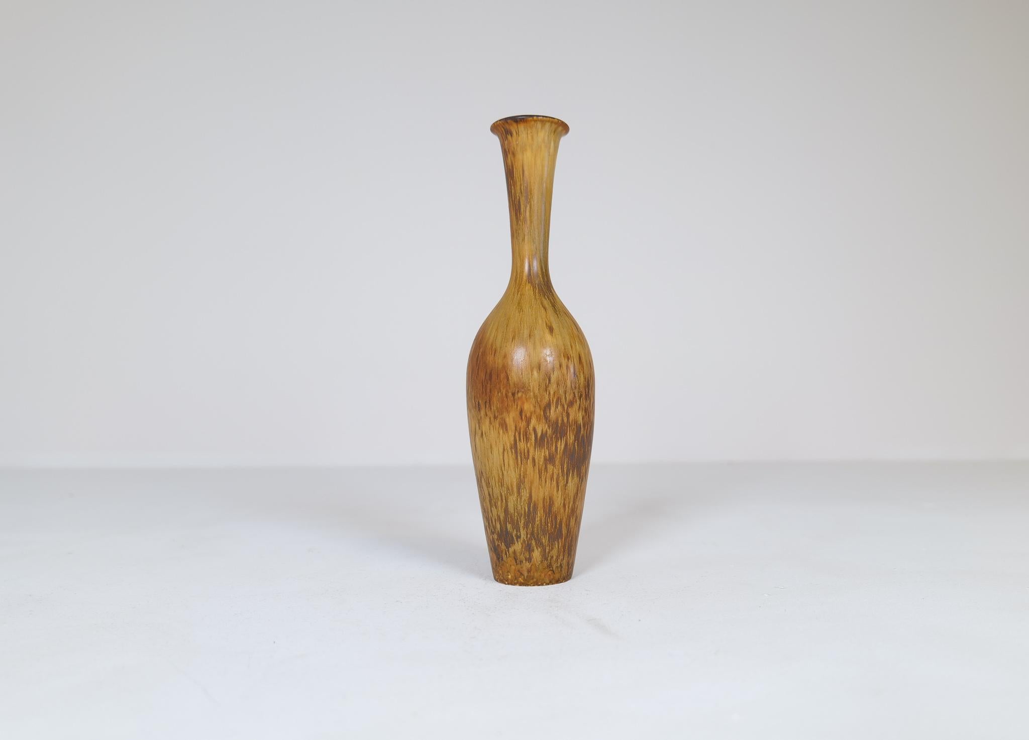 This wonderful large vase was created and designed by Gunnar Nylund at the Rörstrand Factory in the 1950s Sweden. 

The glaze is amazing and works wonderful with the bottleneck shaped vase form. 

Very nice condition. 

Dimensions: H 29 cm, D