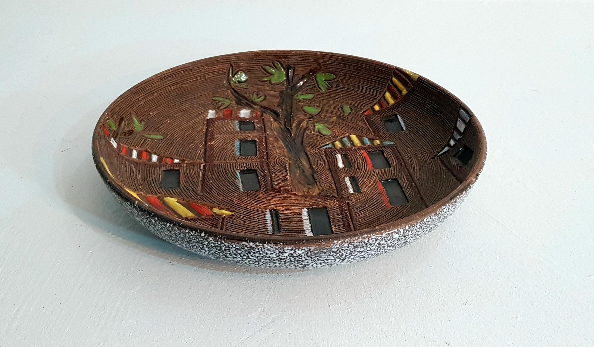 Round ceramic bowl with decor of houses and tree. Can be hung on the wall or used for fruit etc.