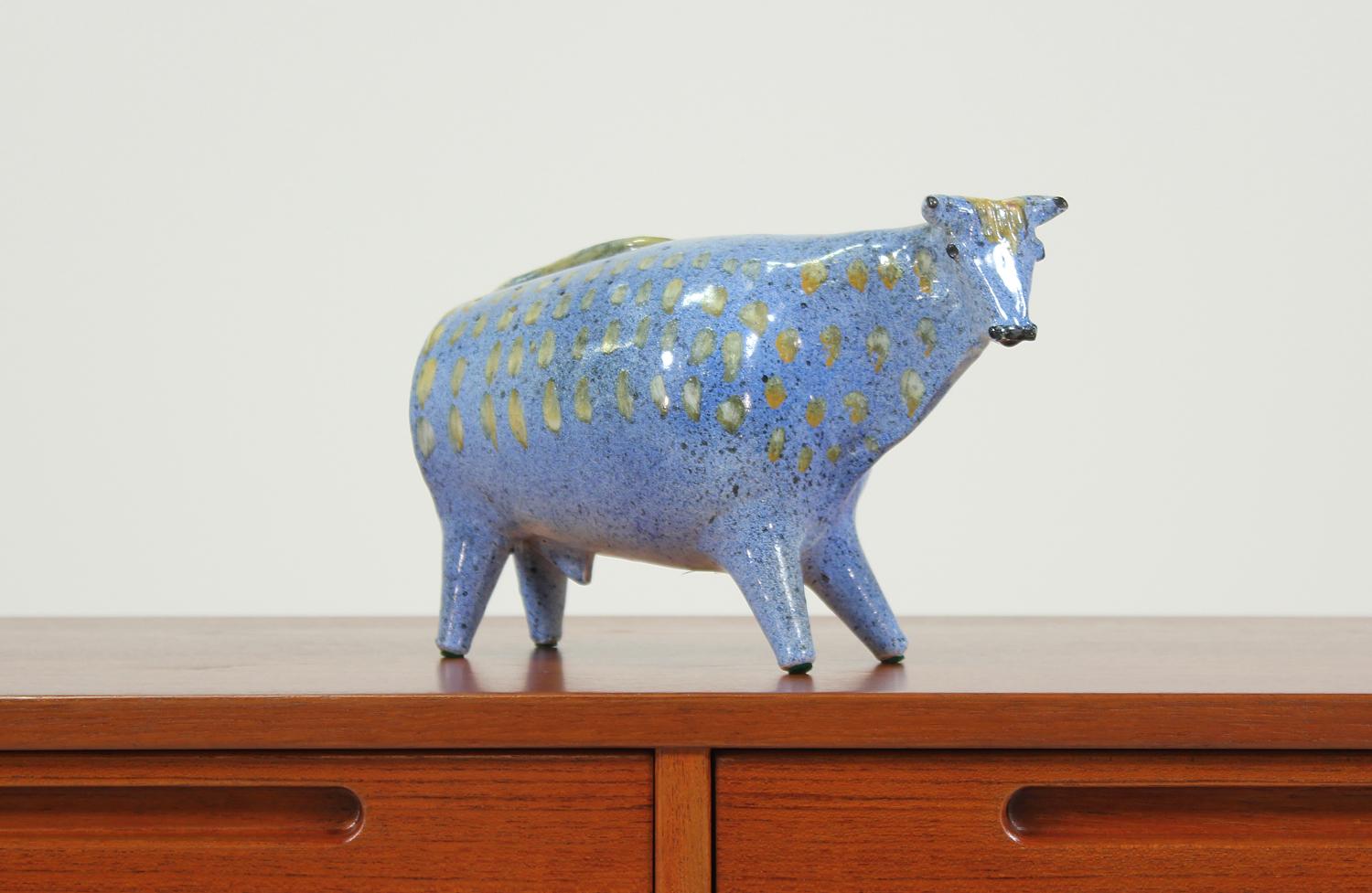 Fine bull sculpture designed and manufactured by Alfaraz in Spain circa 1950’s. This artistic bull sculpture is in excellent condition showing minor wear from use. A wonderfully preserved item made of ceramic painted with in speckled blue and hand