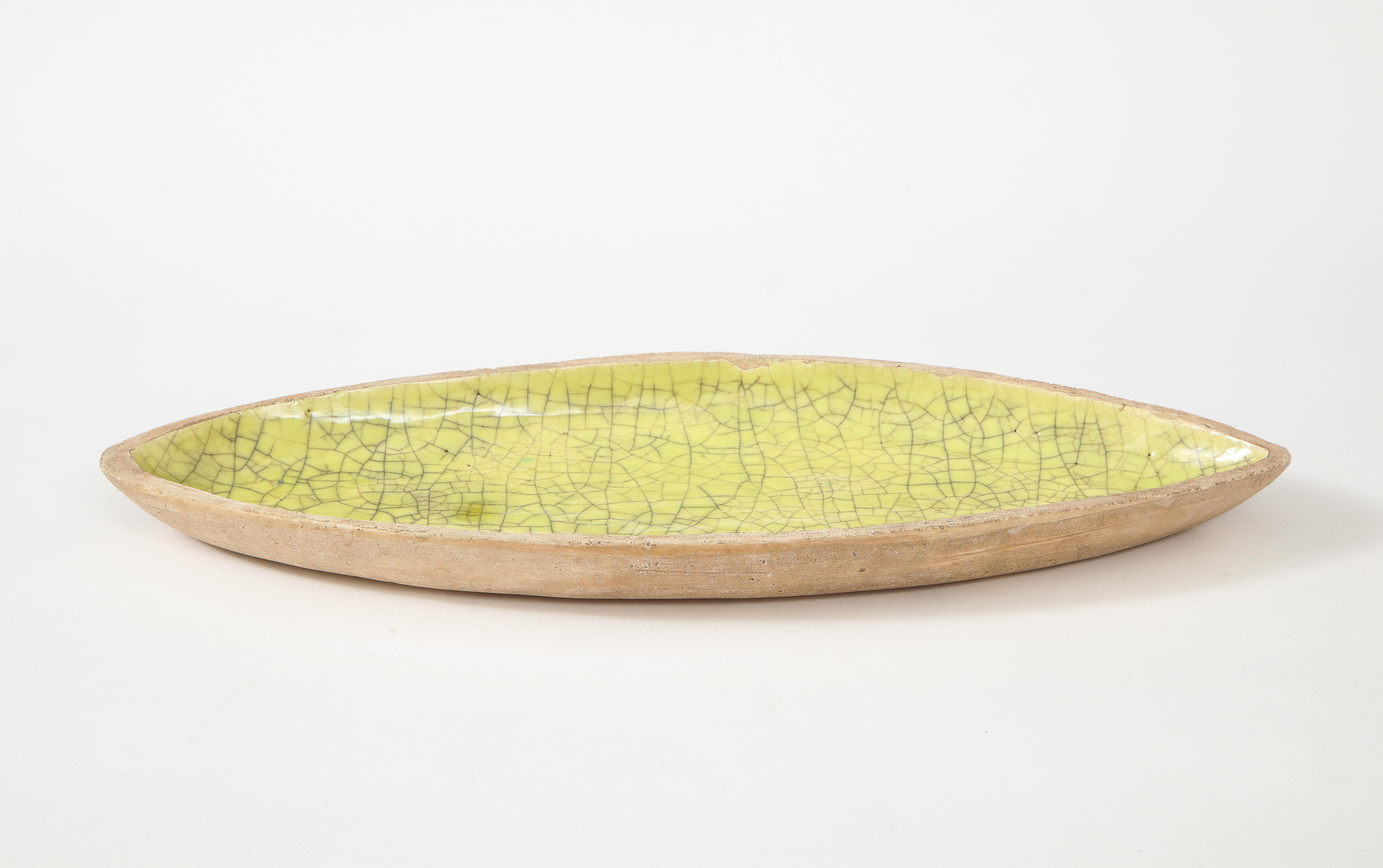 Glazed ceramic plate by Barbara Willis. 

Willis was known for bright, organically shaped studio ceramics in crackling glazes; a respected figure in the midcentury Californian ceramics Community.