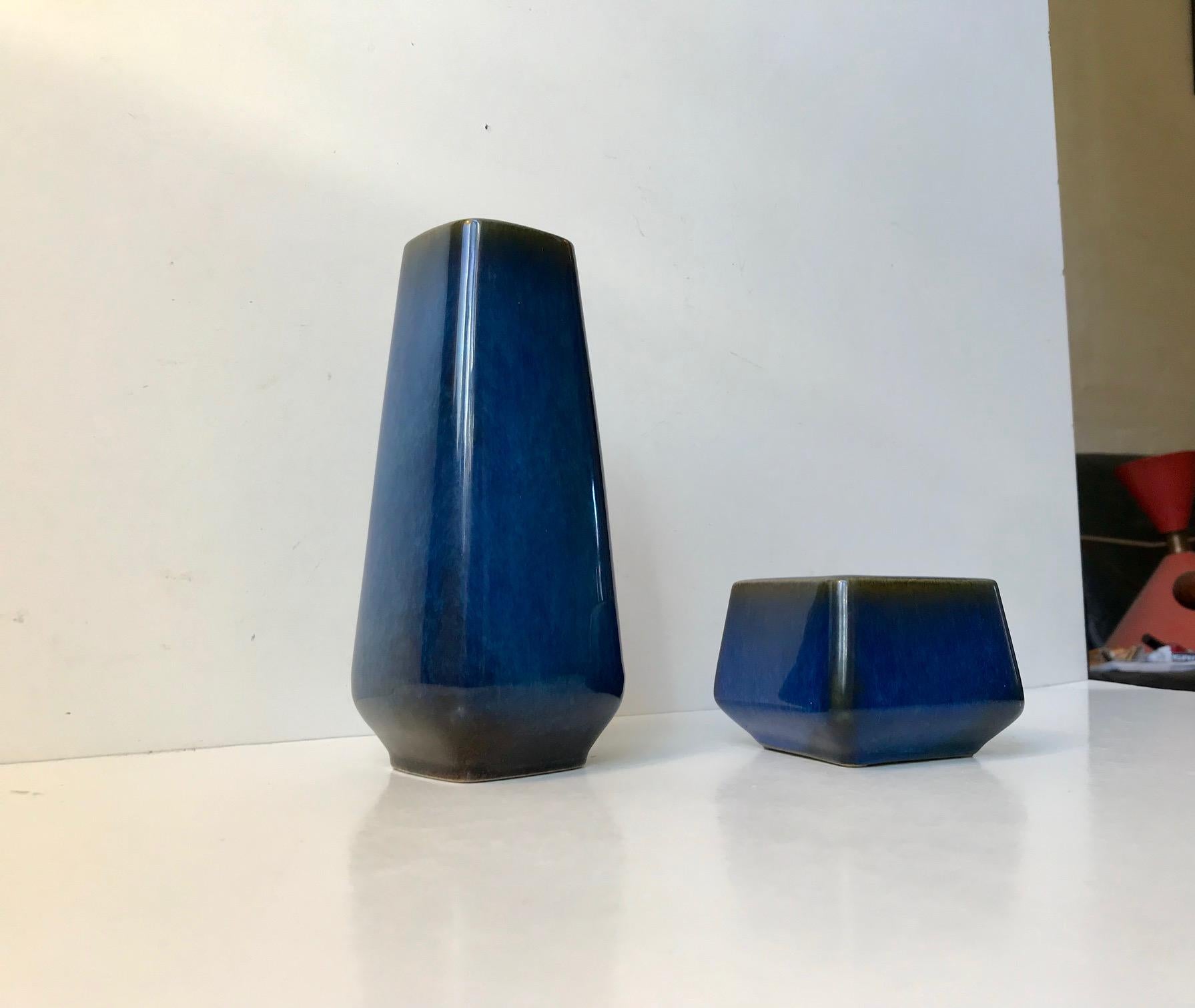 - A matching set of Laguna vases by Sven Jonson
- Manufactured by Gustavsberg in Sweden during the 1960s 
- These ceramic pieces features blue and earthy haresfur type glazes
- Both vases are marked beneath their bases.