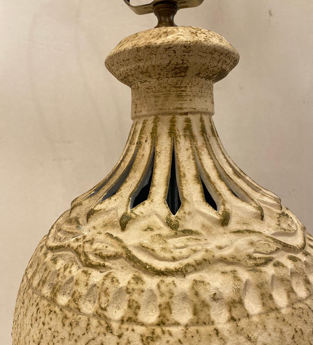 A circa 1960's Italian pierced ceramic lamp.

Measurements:
Height of body: 14.5