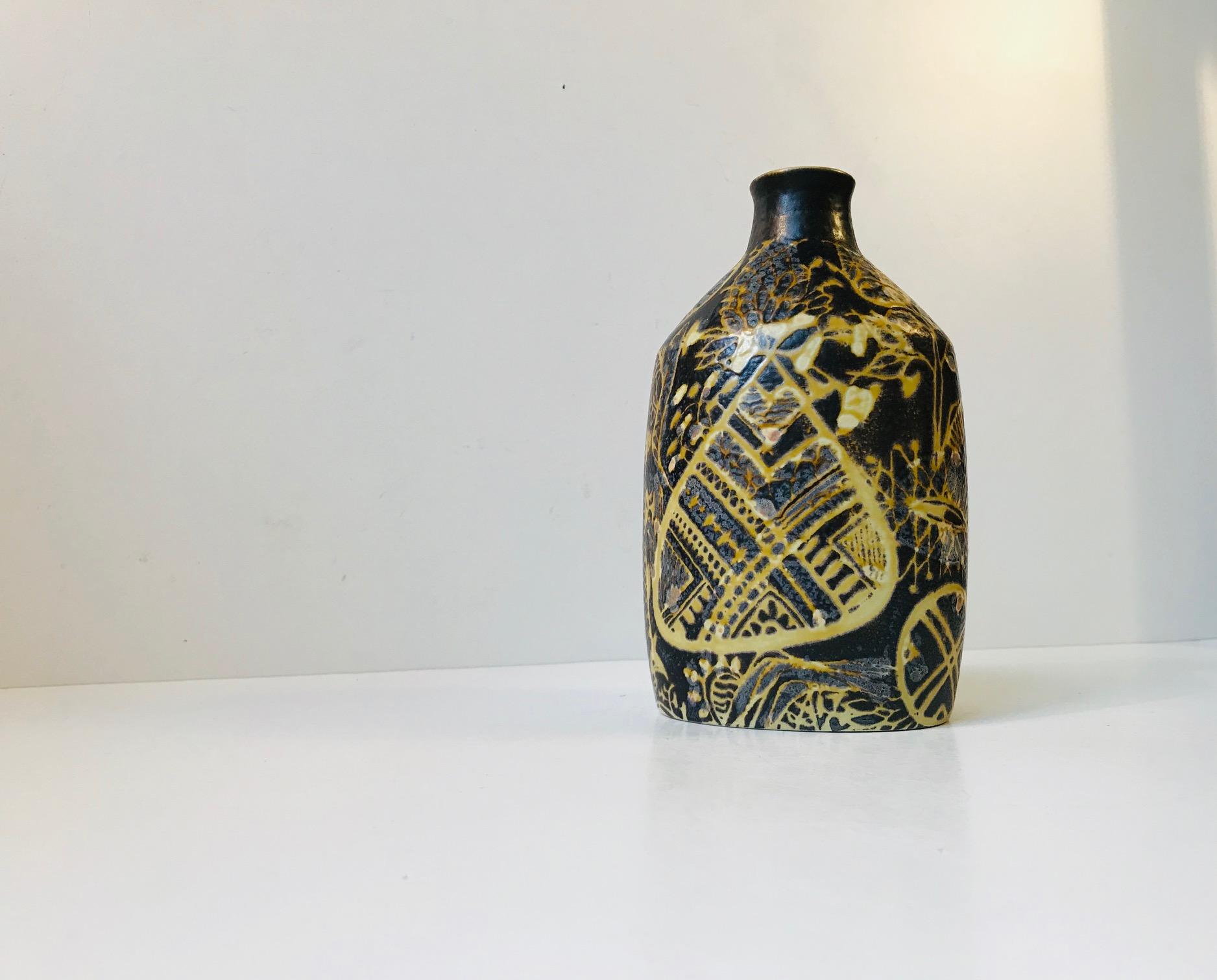 - This ceramic vase was designed by Nils Thorsson and manufactured by Royal Copenhagen in Denmark.
- Decorated in black, yellow and earthy glazes with an abstract motif
- Model number 723/3208
- Marked to the base with the initials of the