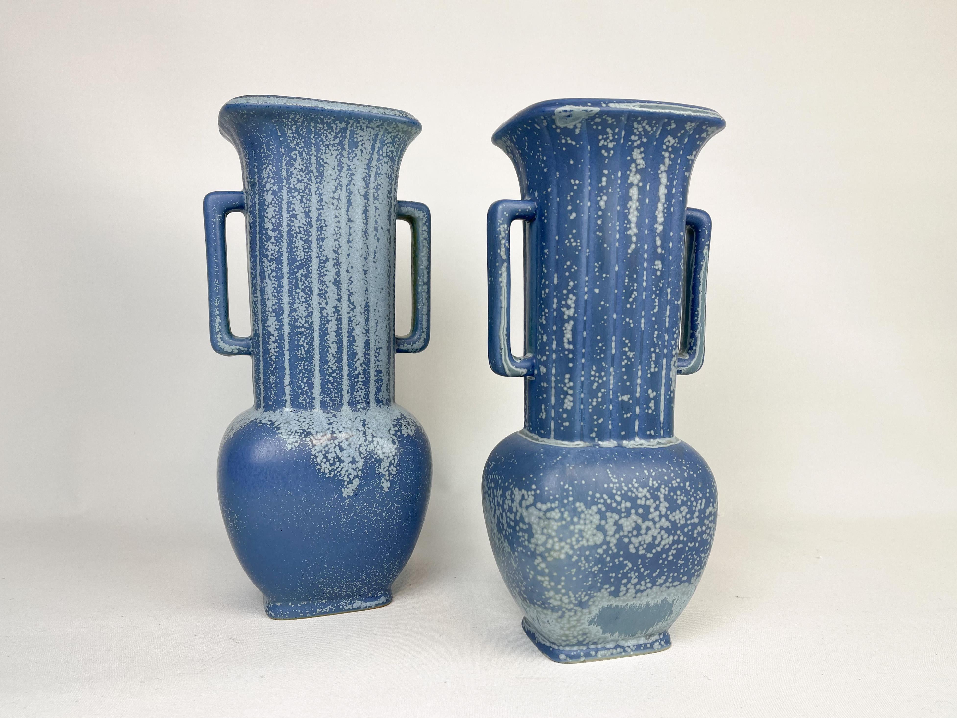 These two wonderful vases were created and designed by Gunnar Nylund at the Rörstrand Factory in the 1950s, Sweden.

Measure: H 31 cm/ W 14cm / D 10 cm and H 28 cm / W 12 / D 10 

Good condition small blue overtone on base on one.
 