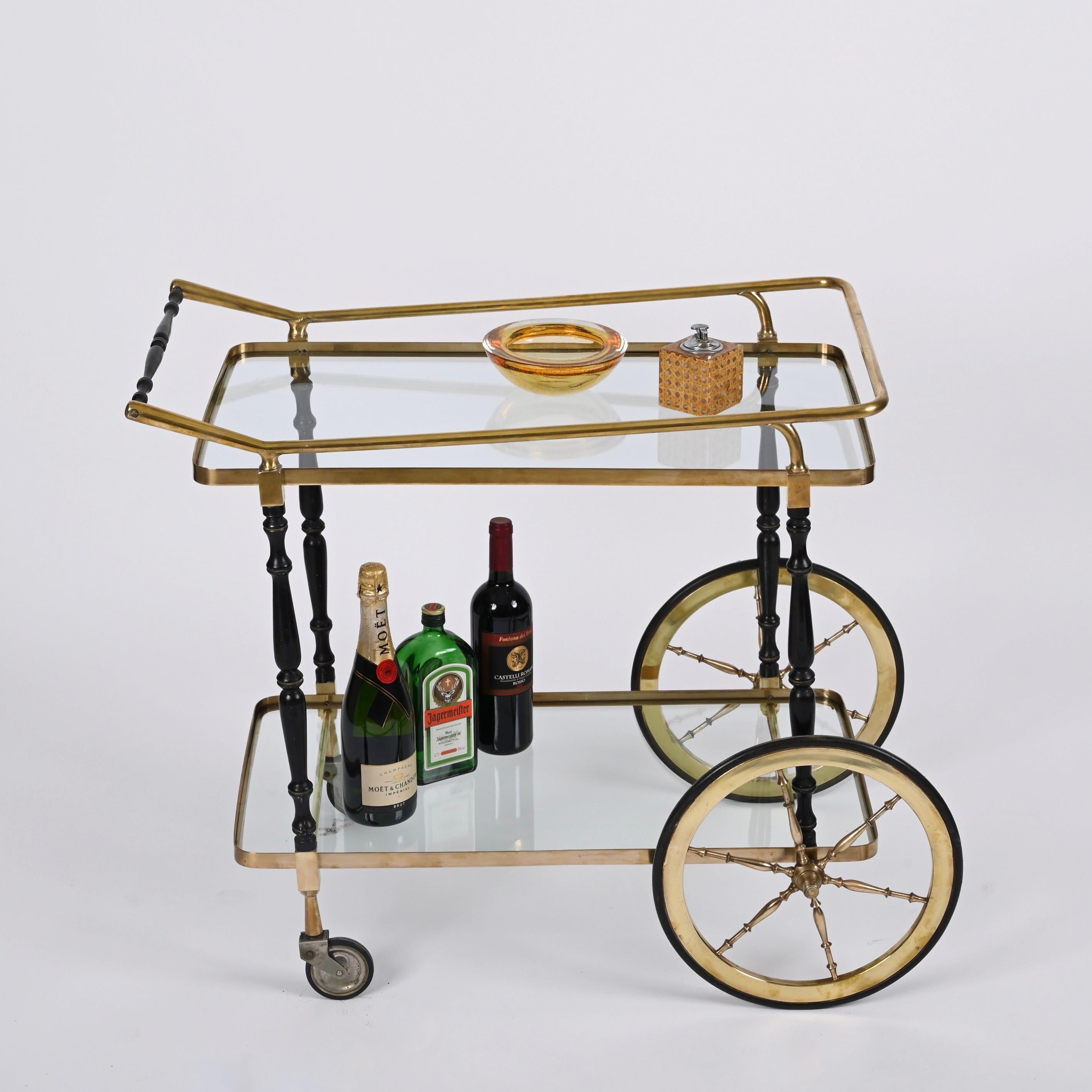 Wonderful midcentury vintage serving table or bar cart with brass frame. Cesare Lacca probably designed this extraordinary item and was produced in Italy during the 1950s.

This item is a very rare, cool and practical midcentury serving and drink