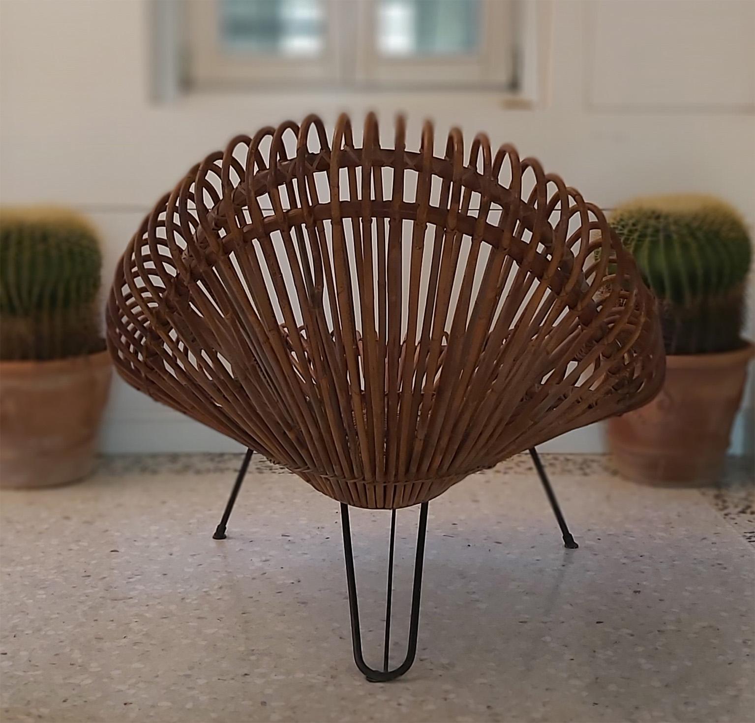 The famous armchair in rattan with three legs by J. Abraham and D.J. Rol, manufactured in Italy for Rougier Edition.
Published.