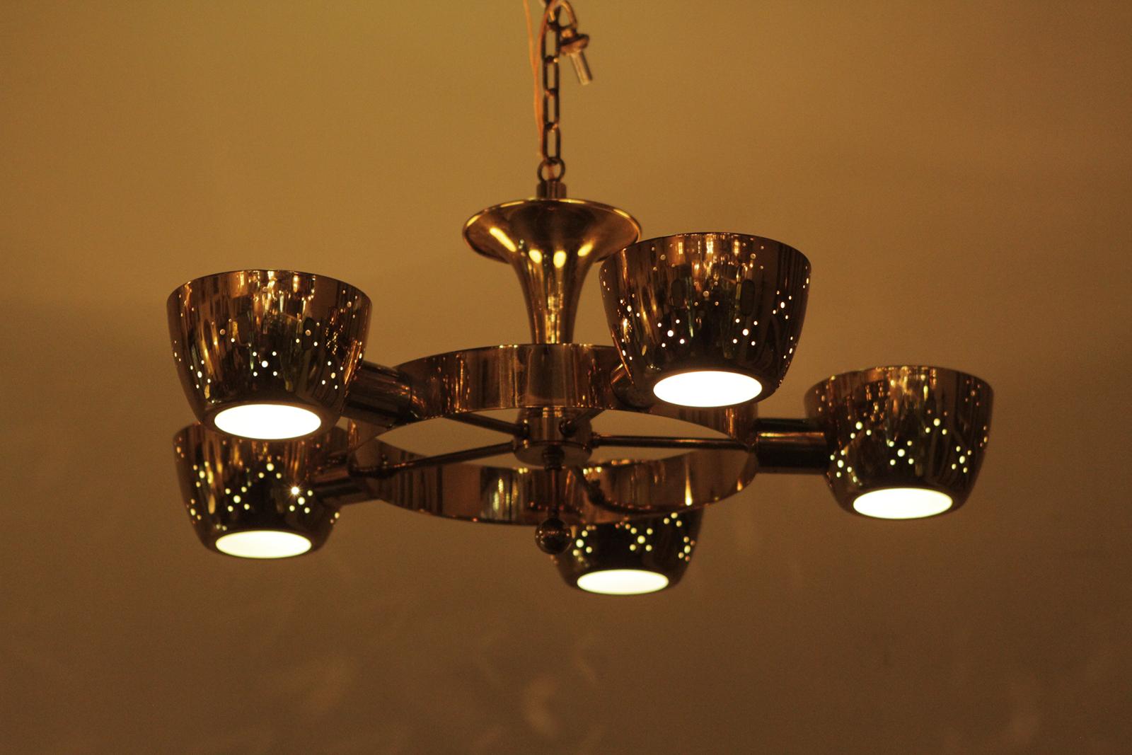 Midcentury chandelier after Gino Sarfatti for Lightolier, USA.
 Dimensions: 13” H x 26” D.