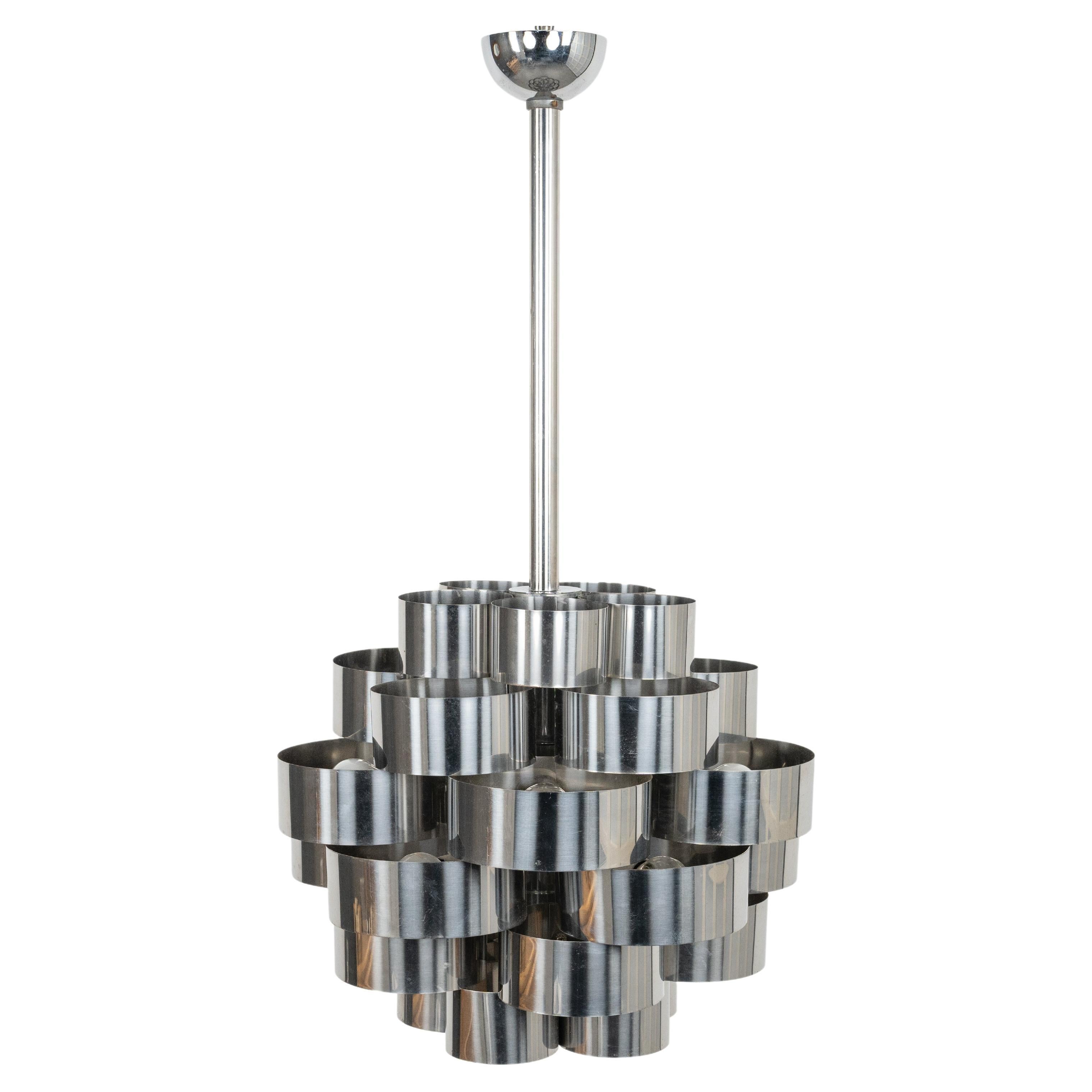 Midcentury amazing chandelier with 10 lights in steel and aluminum curved by Max Sauze for Sciolari.

Made in Italy in the 1970s.

It uses 10 bulbs attack E14, It is wired for the United States or Europe and operate on 110 or 220 Volts.