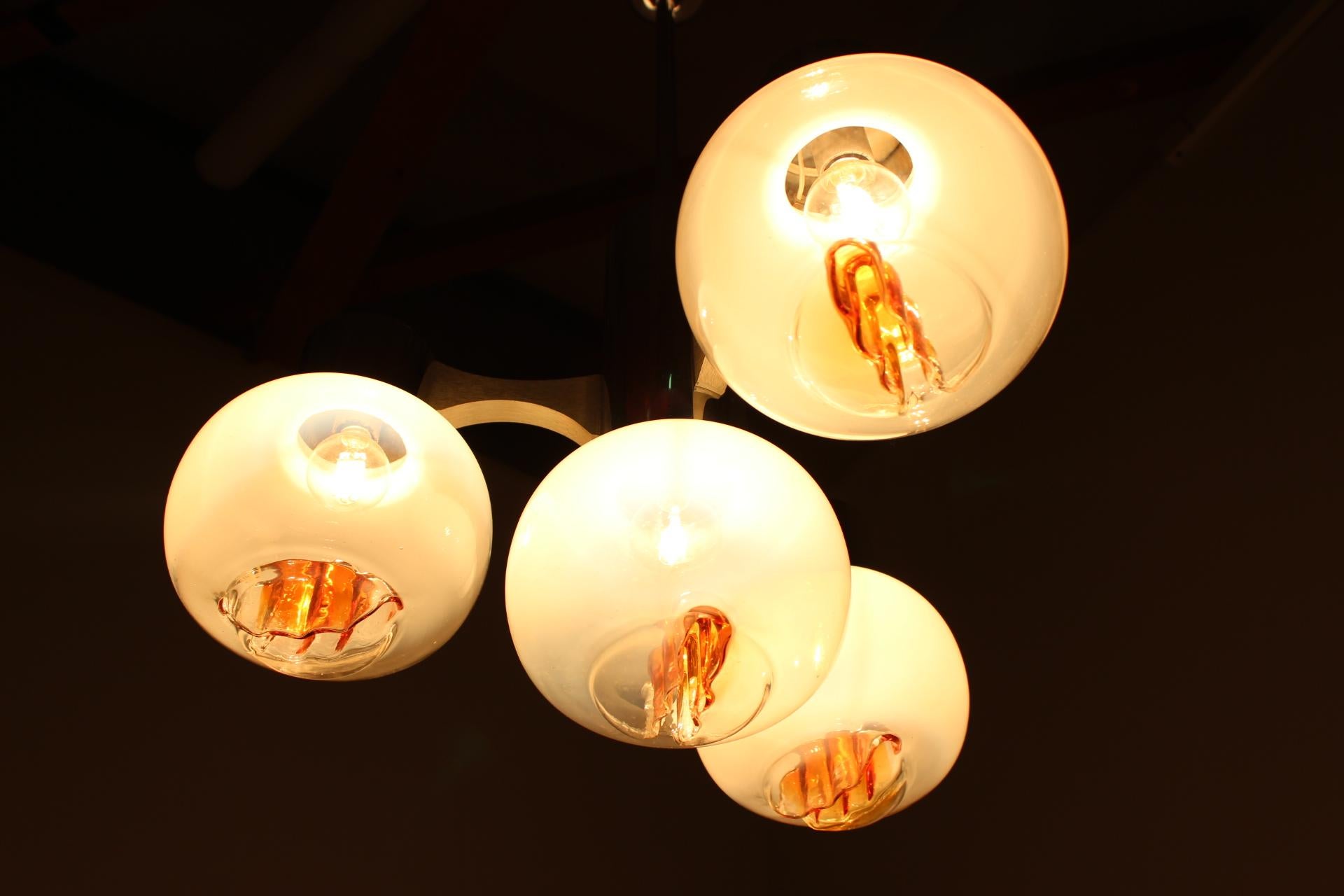 Chandelier. Pendant light. Very nice style of lighting. Four Murano glass balls.