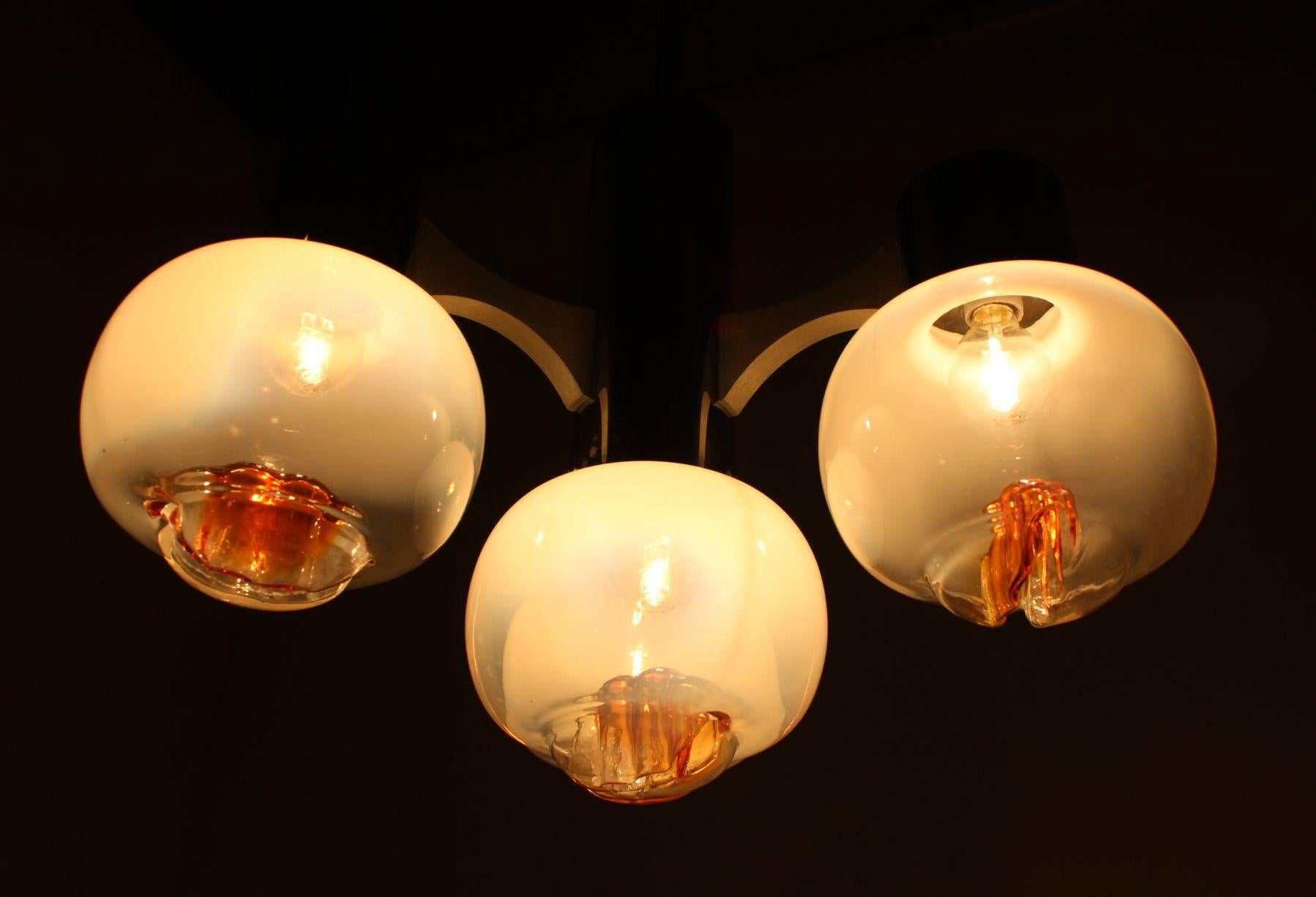 Chandelier, pendant light very nice style of lighting. Four Murano glass balls.