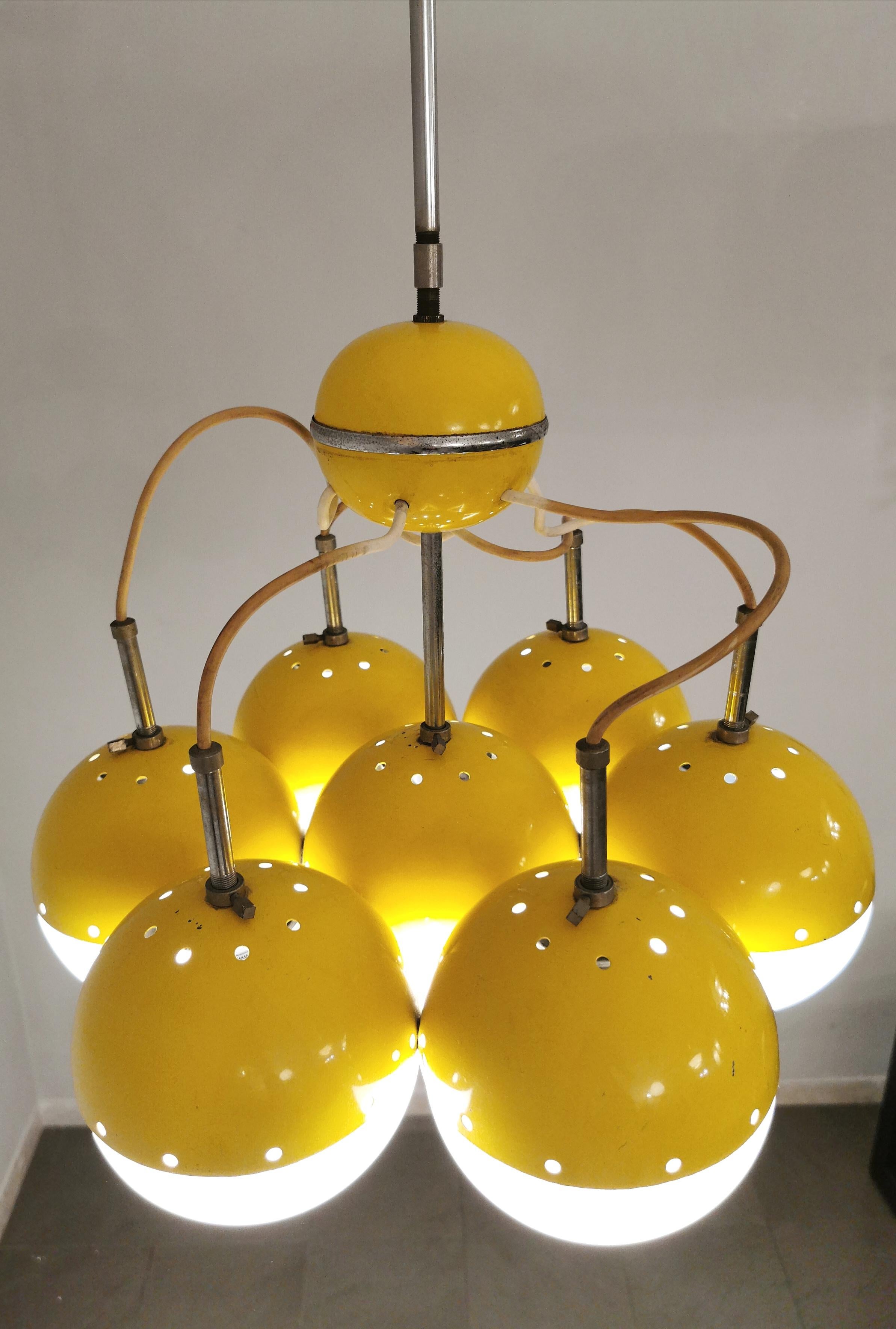 Chandelier designed in the style of Stilnovo in Italy during the 1960s. The chandelier has a yellow enamelled metal structure that supports 7 milky glass bowls and chromed definitions.



Note: We try to offer our customers an excellent service even
