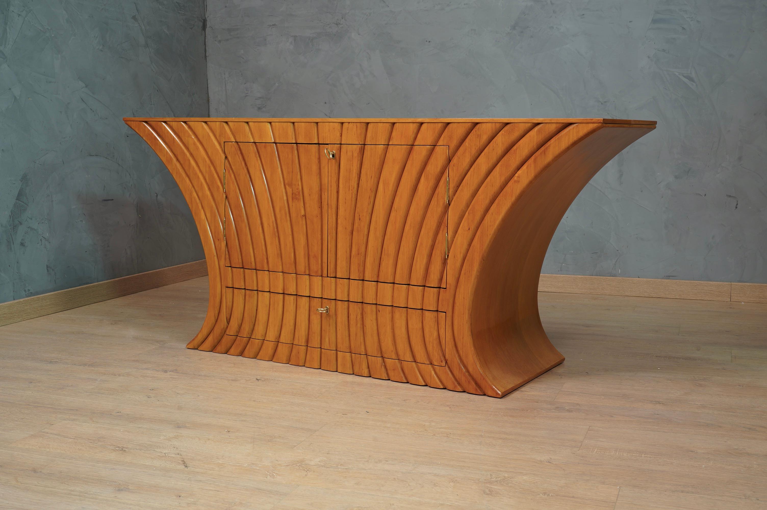 All refinement and style, knows no limits, this charismatic sideboard has an indisputable timeless design, typical of an elegant and unique furniture.

All veneered in cherry wood, It is a very valuable wood because it has a very nice patina. The