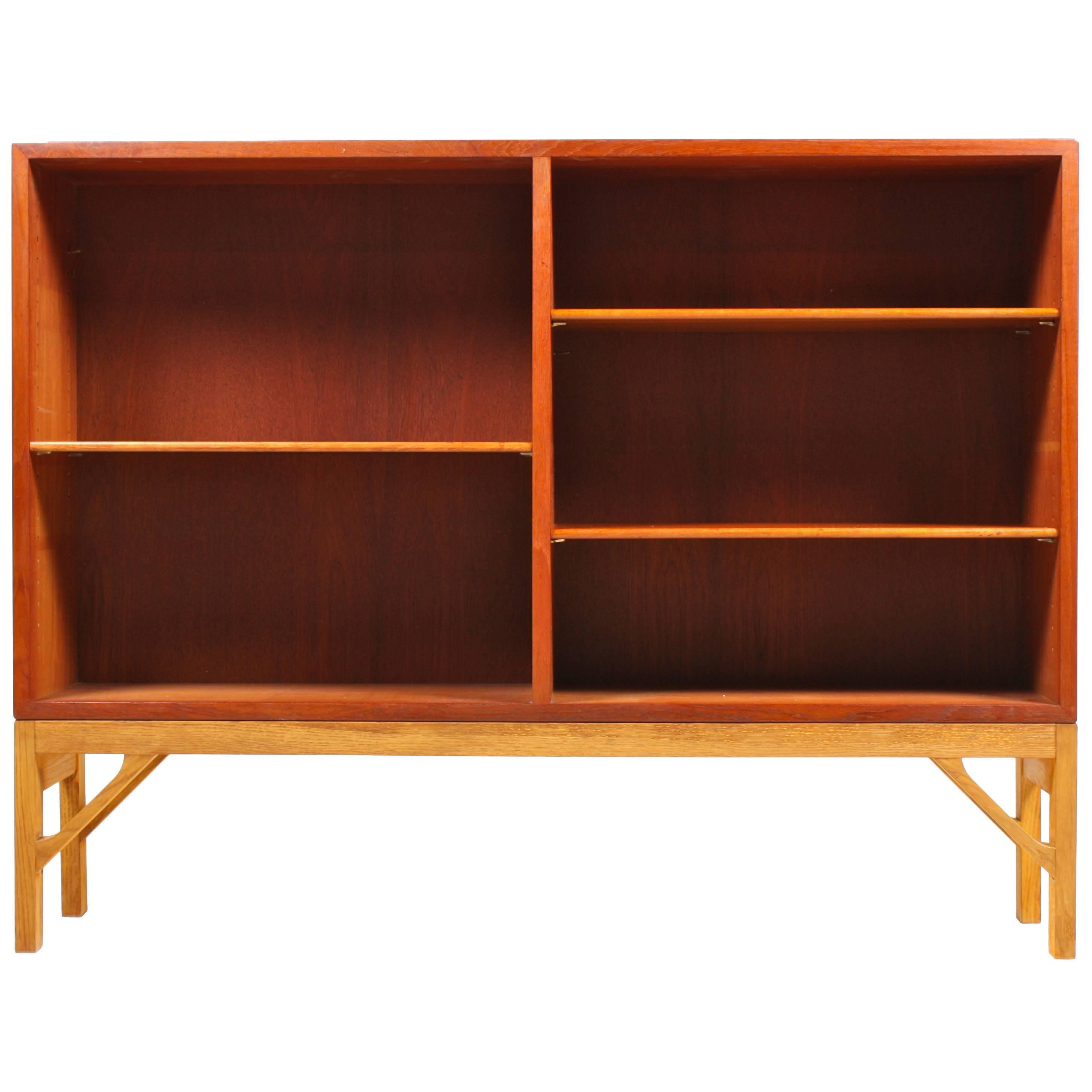 Low China bookcase in teak on a solid oak base. Designed by MAA. Børge Mogensen in 1958, this piece is made by CM Madsen cabinetmakers Denmark in the 1960s. Great original condition. More shelves available.
