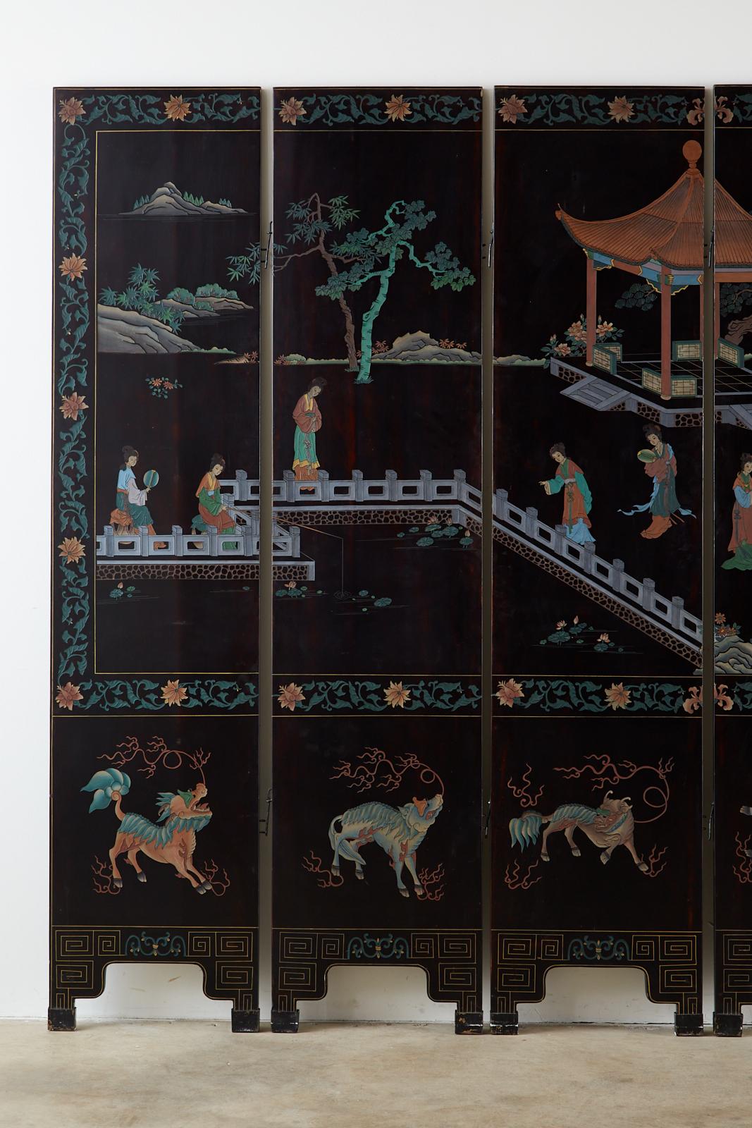 Stunning midcentury Chinese export six-panel lacquered Coromandel screen featuring a pavilion landscape with beauties. Beautifully crafted with incised lacquer painted with surreal colors that stand out boldly against the smooth black lacquer. The