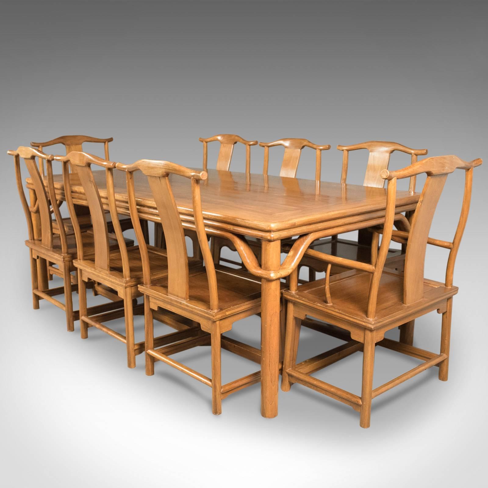 This is a superior quality dining suite from the midcentury of Classic Chinese design, comprising of a table and eight chairs in the traditional taste.

Mellow in color with good grain interest in the Chinese rosewood
The planked tabletop