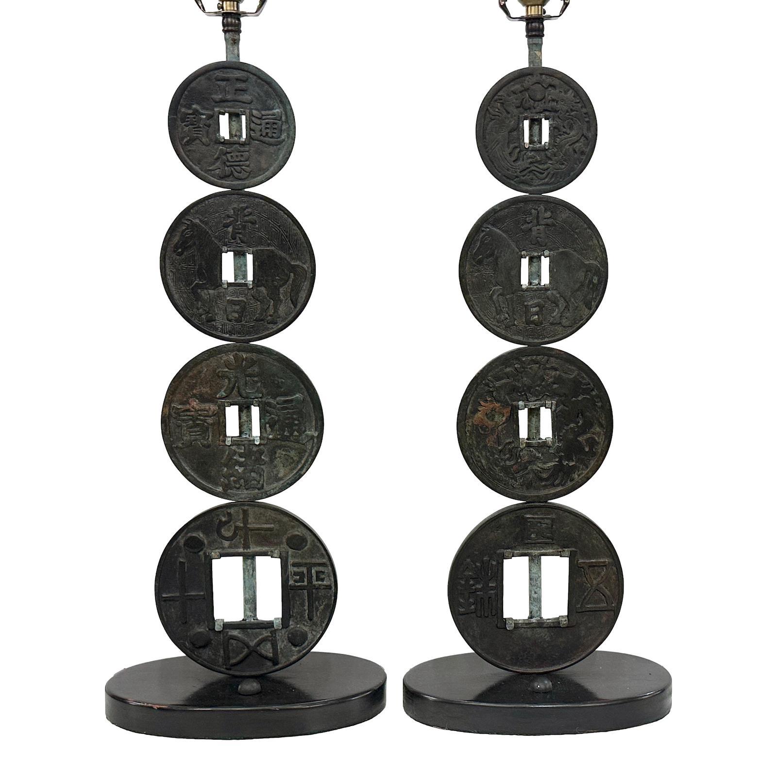 Pair of circa 1950's Chinese patinated bronze coins lamps.

Measurements:
Height of body: 23