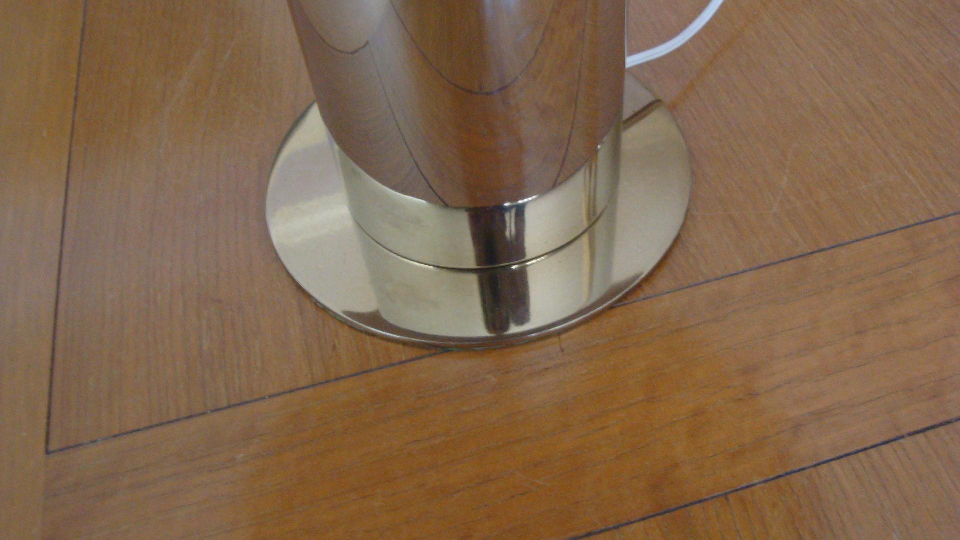 This is a Chrome cylinder lamp on a brass base with a black metal round shade.