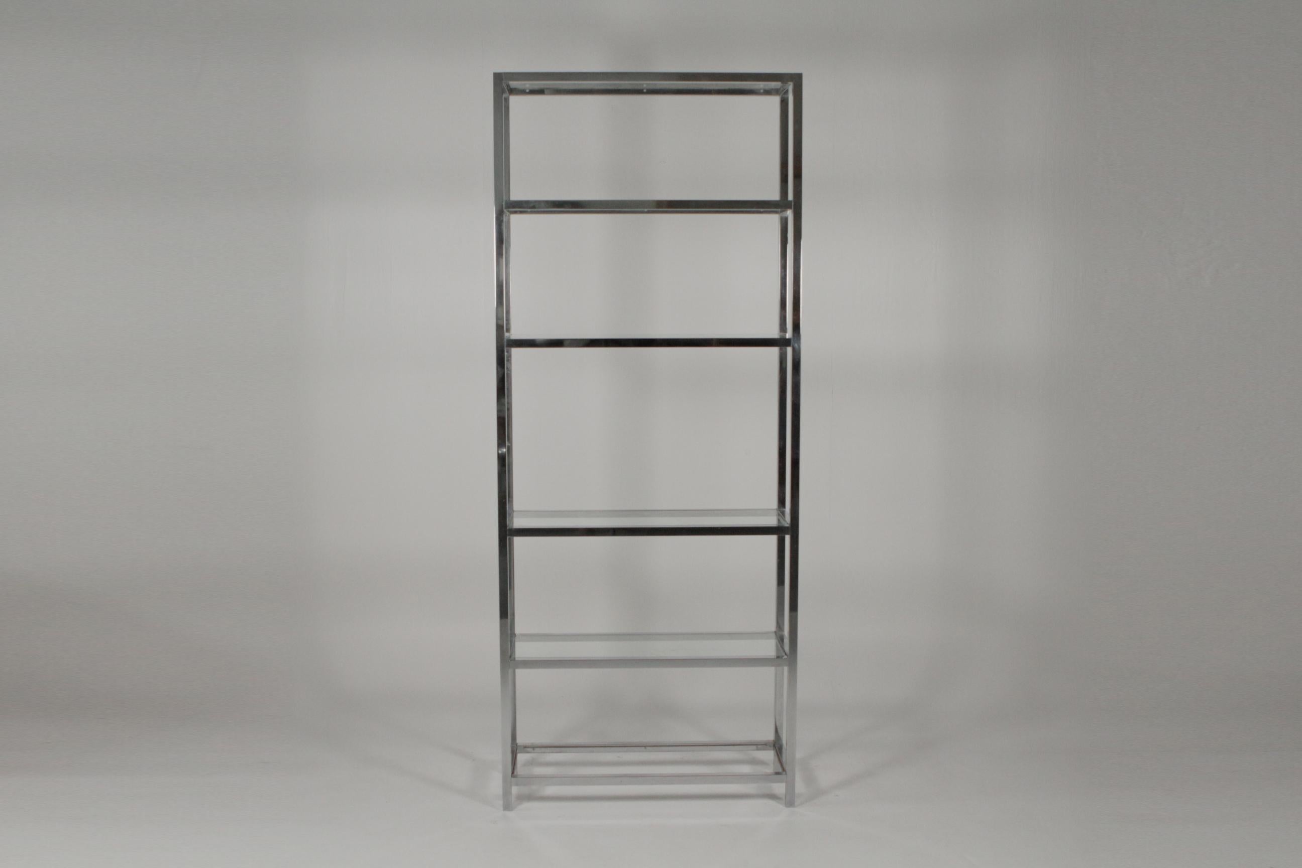 Midcentury chrome and glass étagère, 1970s. Simplistic shape with nine tiers of glass shelving. Smaller size and perfect for city living. Measures: 79”H X 32”W X 12”D 