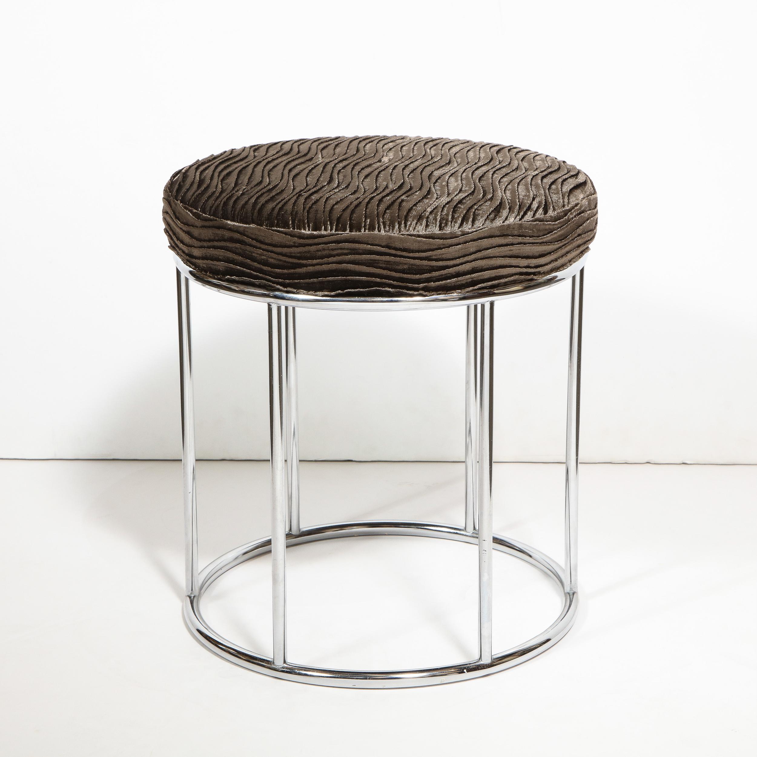 This stunning pair of stool was realized by the esteemed American designer Arthur Umanoff in the United States, circa 1960. It features circular polished chrome frames with six vertical cylindrical supports in the same material. It has been newly