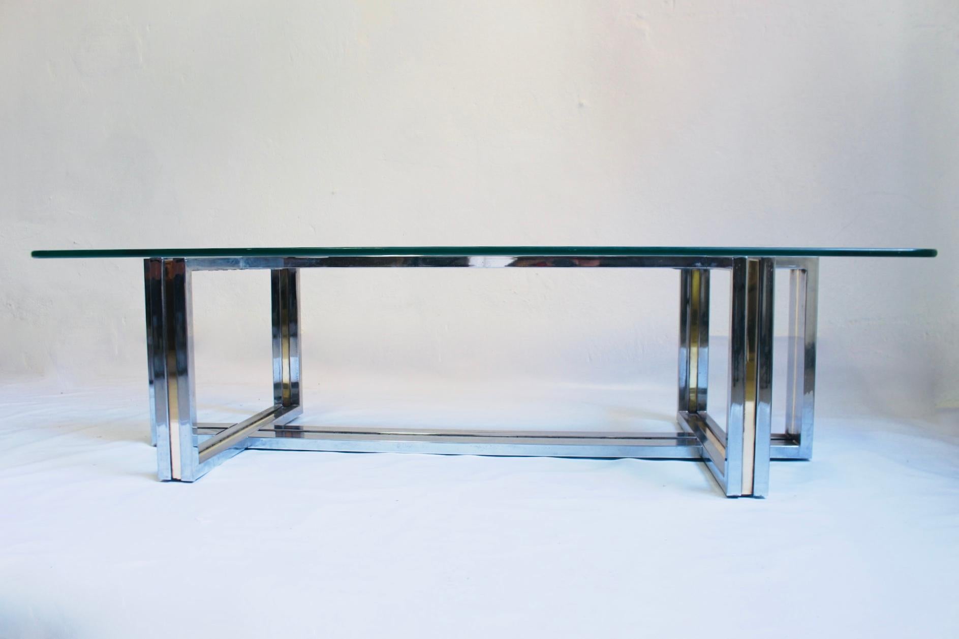 Midcentury Italian chrome and brass coffee table in the manner of Romeo Rega, Italy, 1970s.
Fair condition: There some signs of wear over the metal structure, without affect to the general look of the piece (pictured).