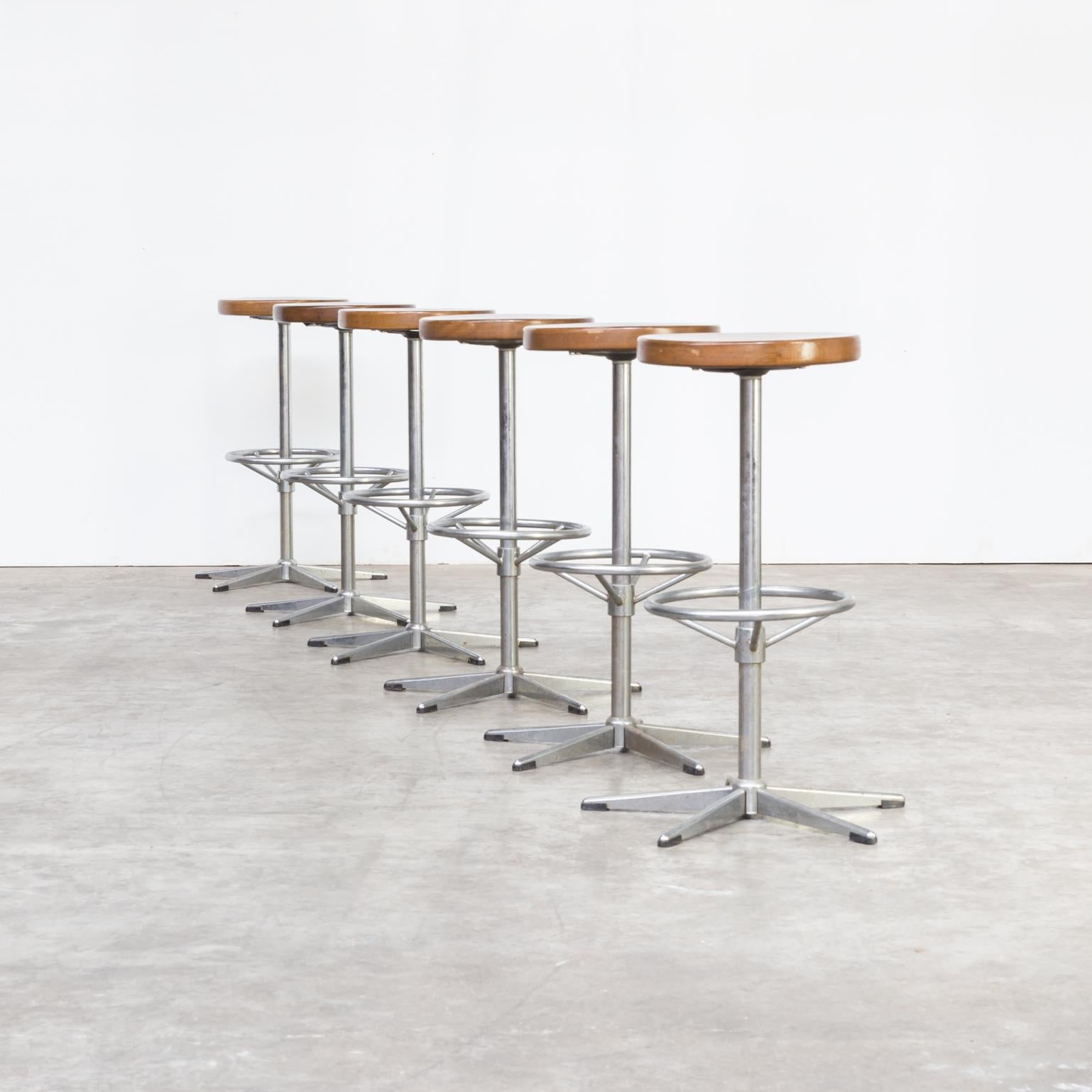 One set of six midcentury chrome framed stools with wooden seat. Good condition consistent with age and use.