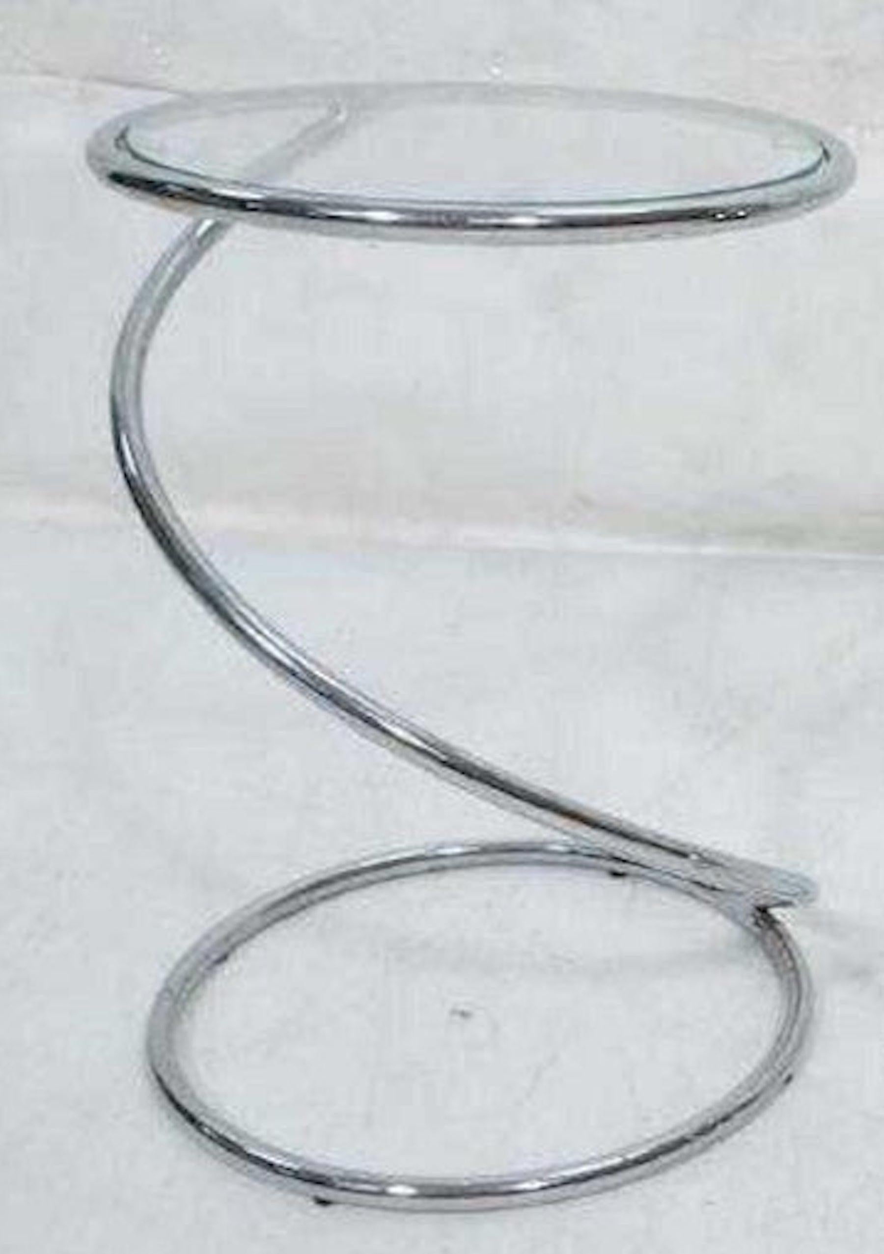 Midcentury chrome spring tables, by Pace, each one of polished chrome with inset (removable) sold individually
Measures: 11” depth x 3/8” thickness glass tops.
