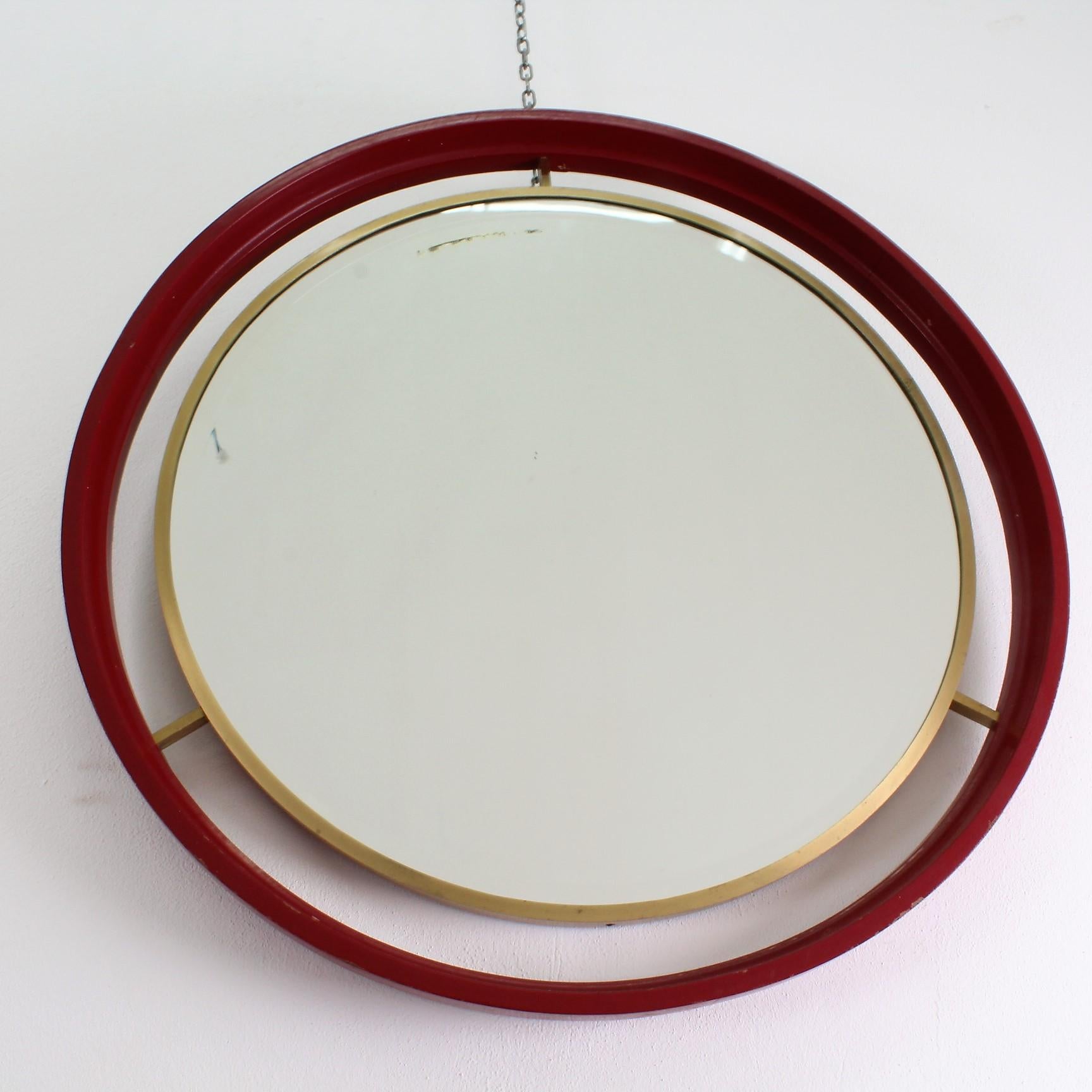 Midcentury circle red wood brass Italian vintage mirror, 1960.
Wear consistent with age and use.