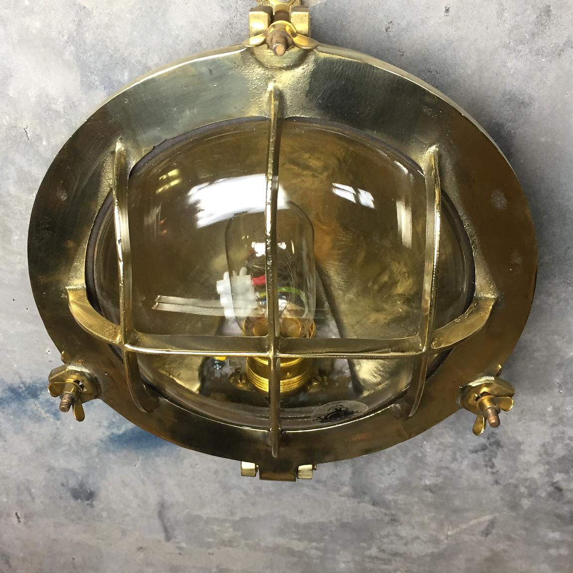 Mid-Century Circular Industrial Cast Brass Circular Wall Light with Glass Dome For Sale 4