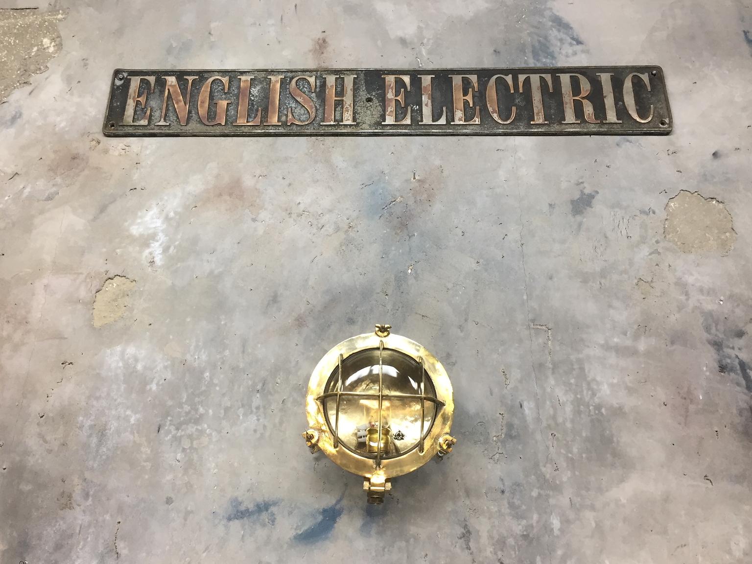 German Mid-Century Circular Industrial Cast Brass Circular Wall Light with Glass Dome For Sale