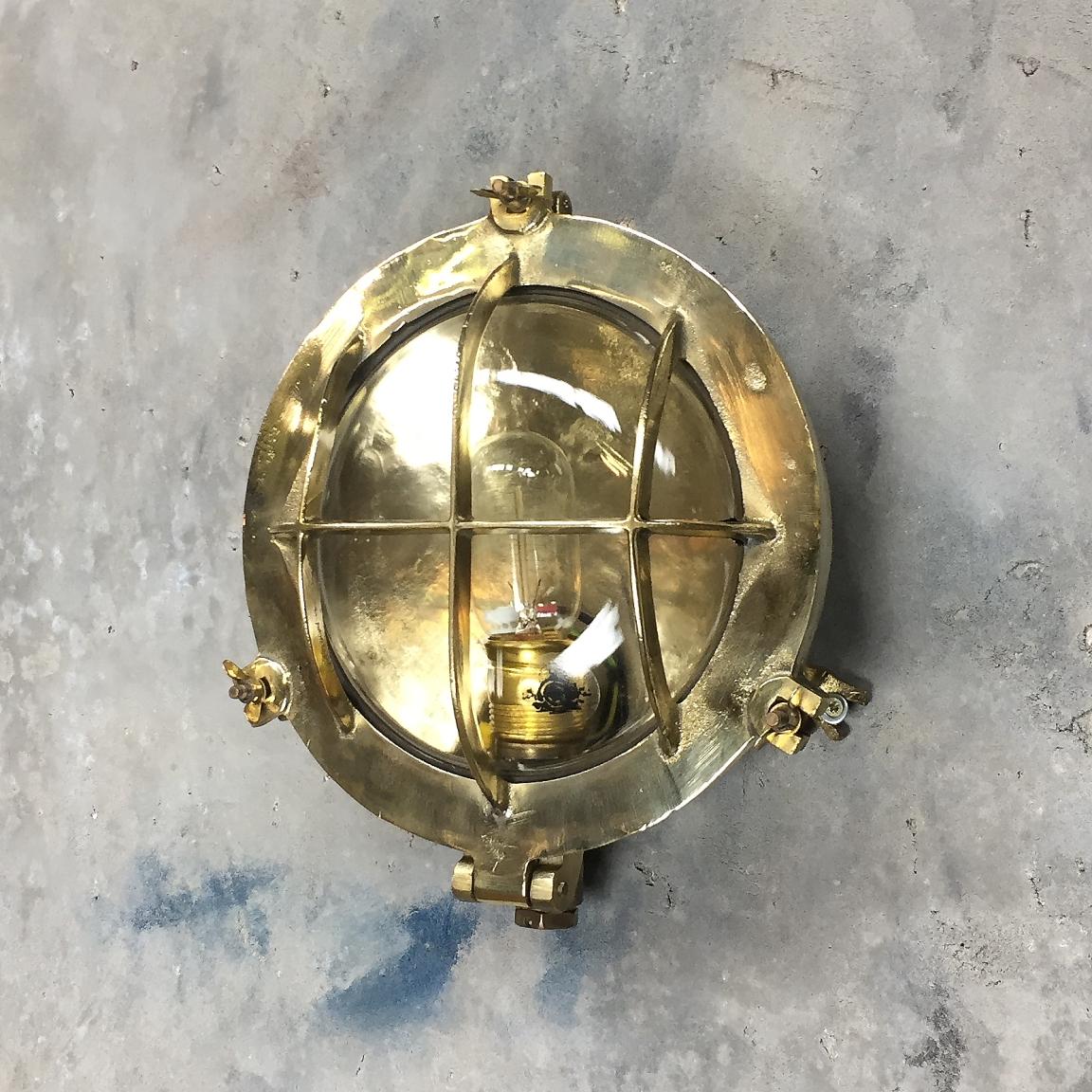 Tempered Mid-Century Circular Industrial Cast Brass Circular Wall Light with Glass Dome For Sale