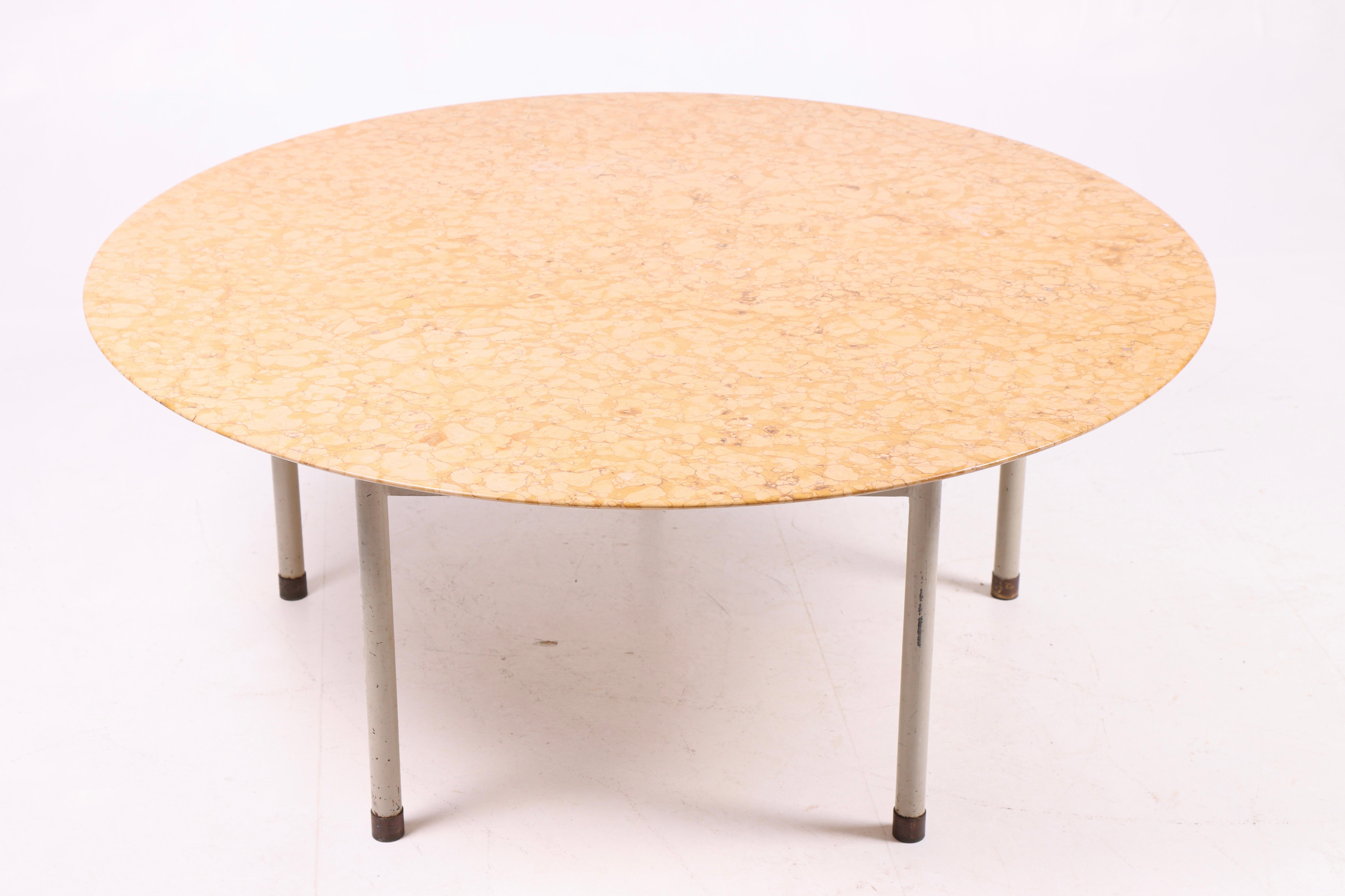 Rare Low table with five legged light grey lacquered metal frame, brass “shoes” and Red Verona marble top. Designed and made 1940–1950s, Denmark. 