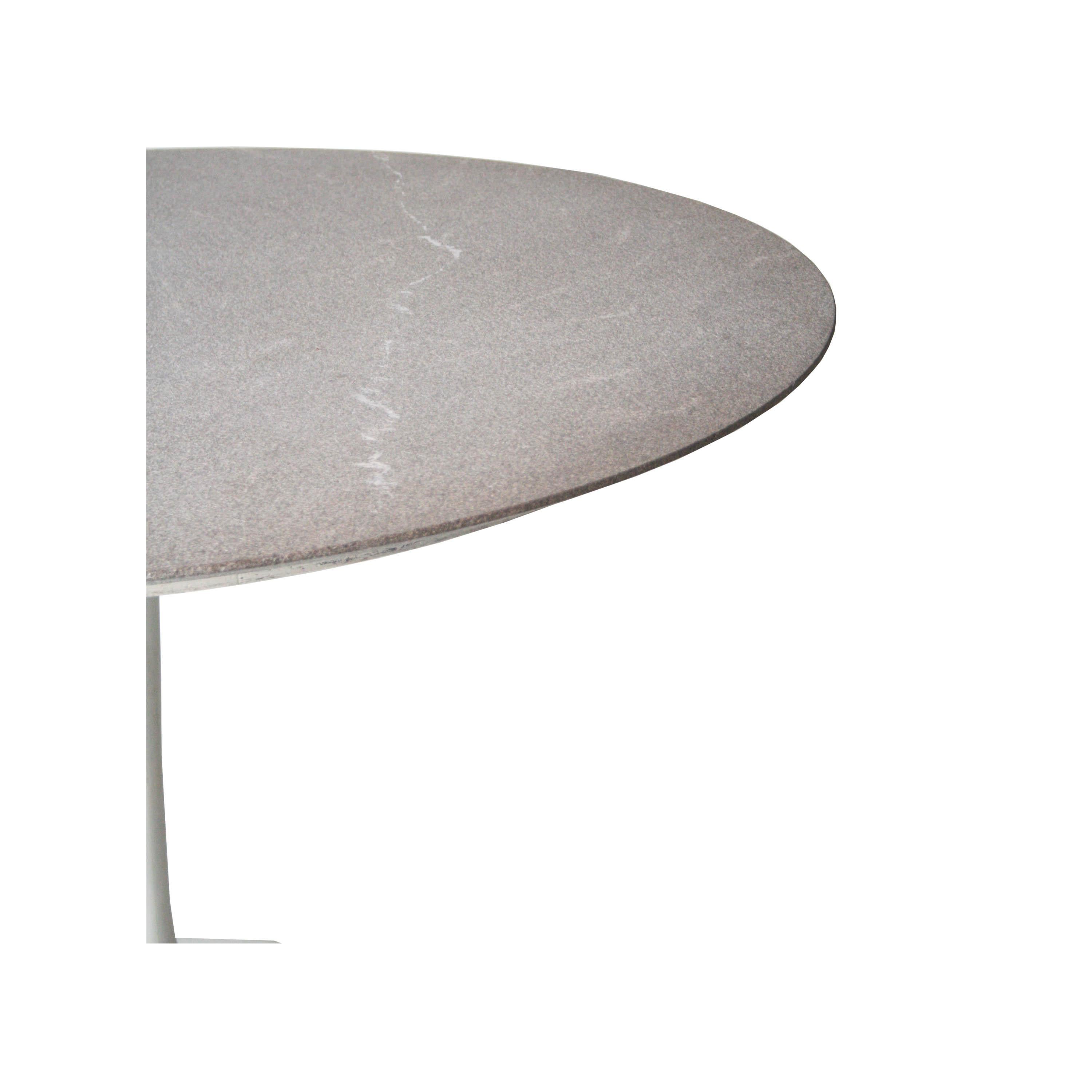 Dining table with granite circular top and circular white base 