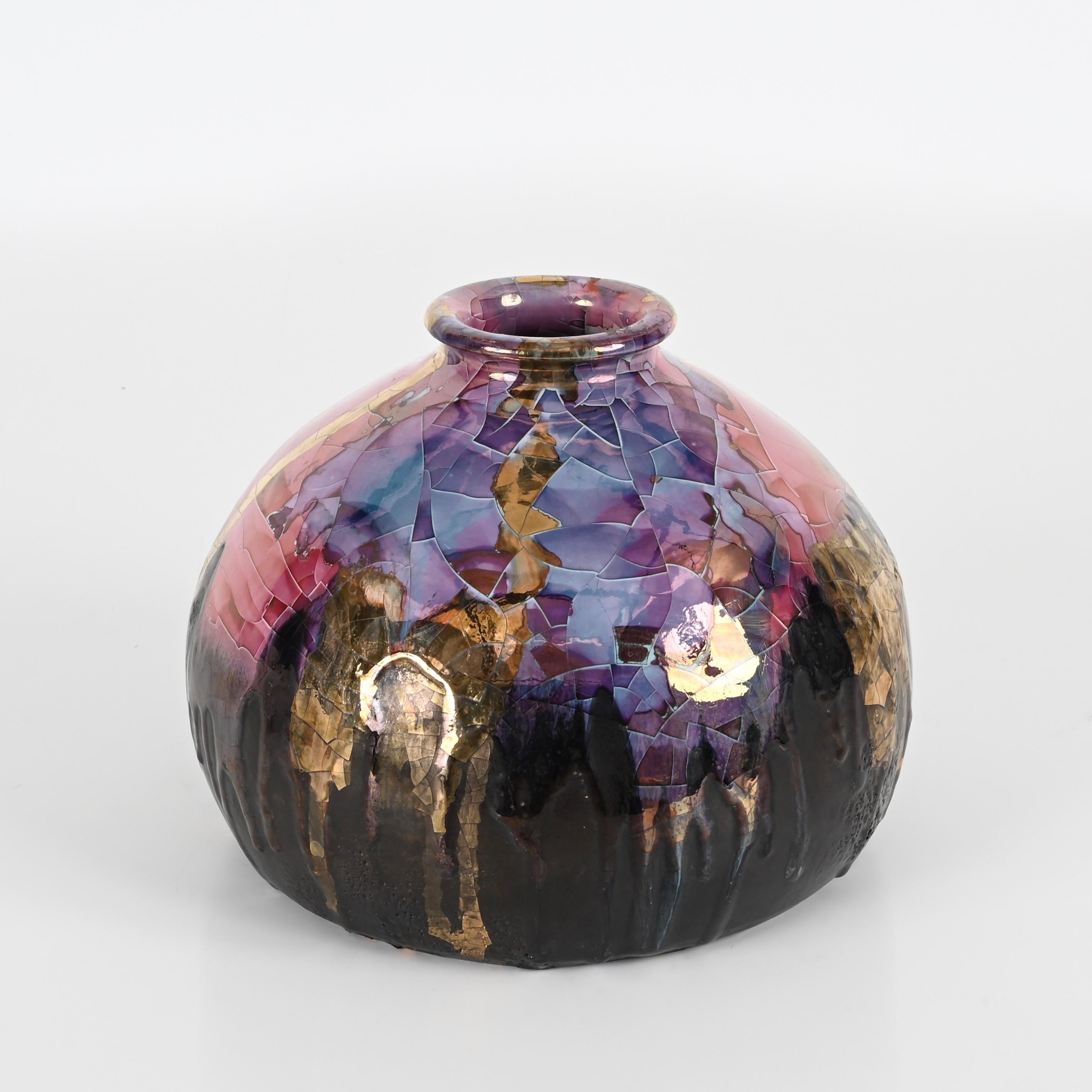 Stunning polychrome enameled ceramic vase designed and signed on the bottom by Claudio Pulli, one of the greated Sardinian artists of the 20th century. This charming vase was realized in Italy during the 1970s.  

This gorgeous round-shaped vase is