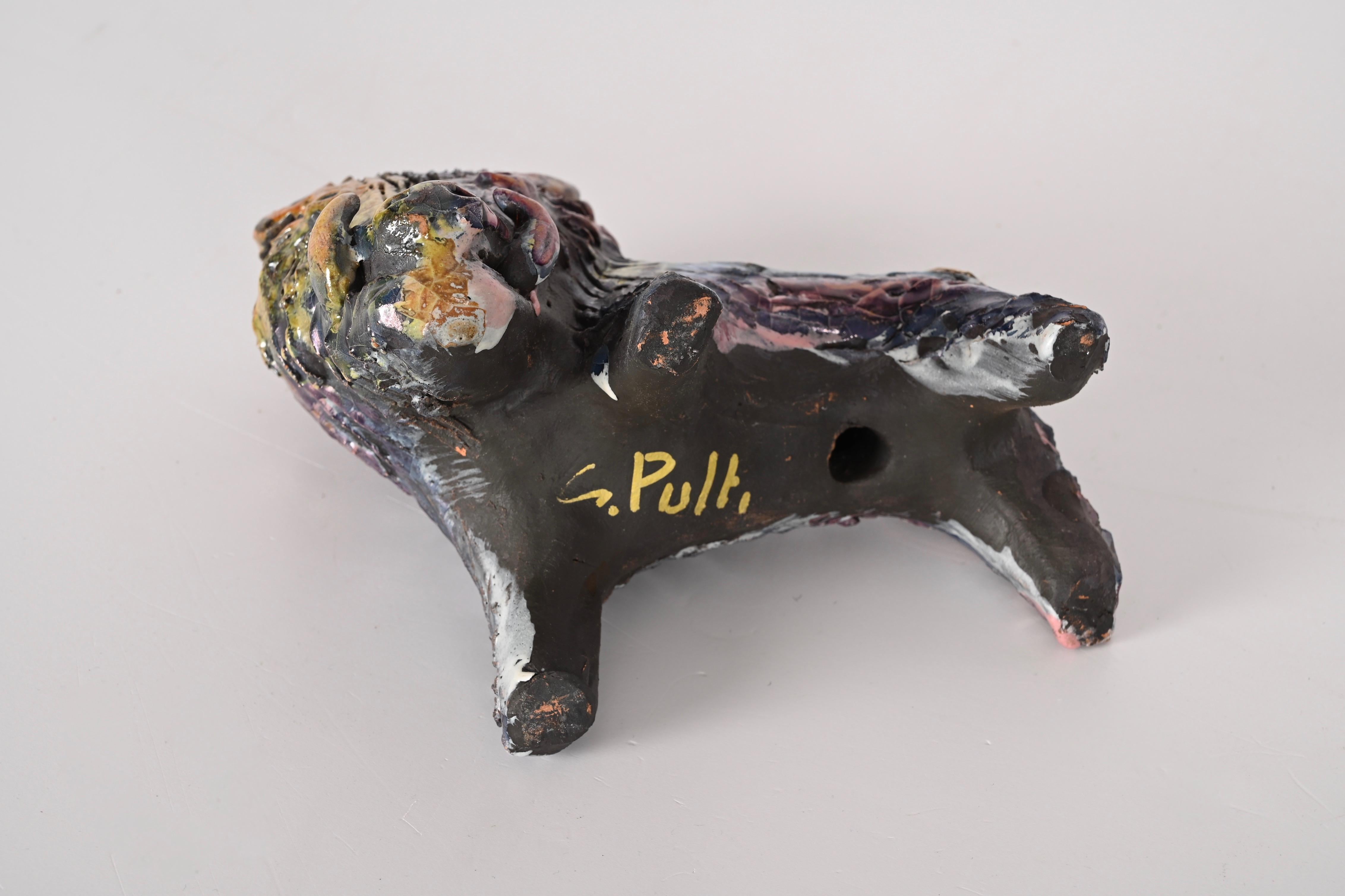 This polychrome ceramic boar is a wonderful production of Claudio Pulli, one of the greatest Sardinian artists of the twentieth century.

The wild boar was produced for I.S.O.L.A. and is made of glazed ceramic, colored with metallic luster enamels.