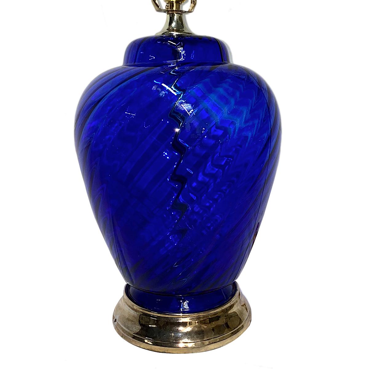 A circa 1960's French blown blue glass table lamp with gilt metal base.

Measurements:
Height: 13.5