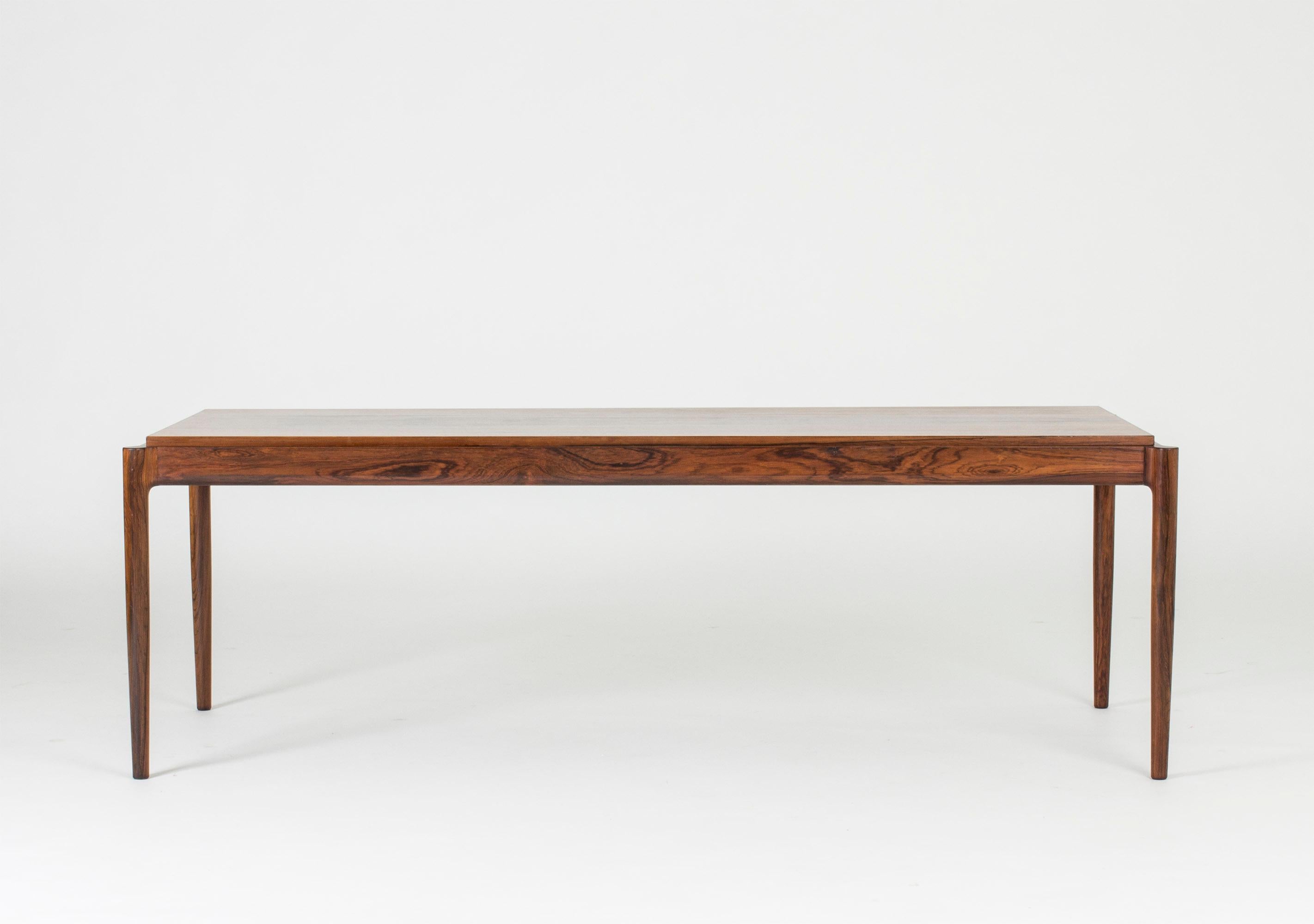 Coffee table with cool attachment of the legs to the table top by Ib Kofod Larsen, made in beautiful rosewood.