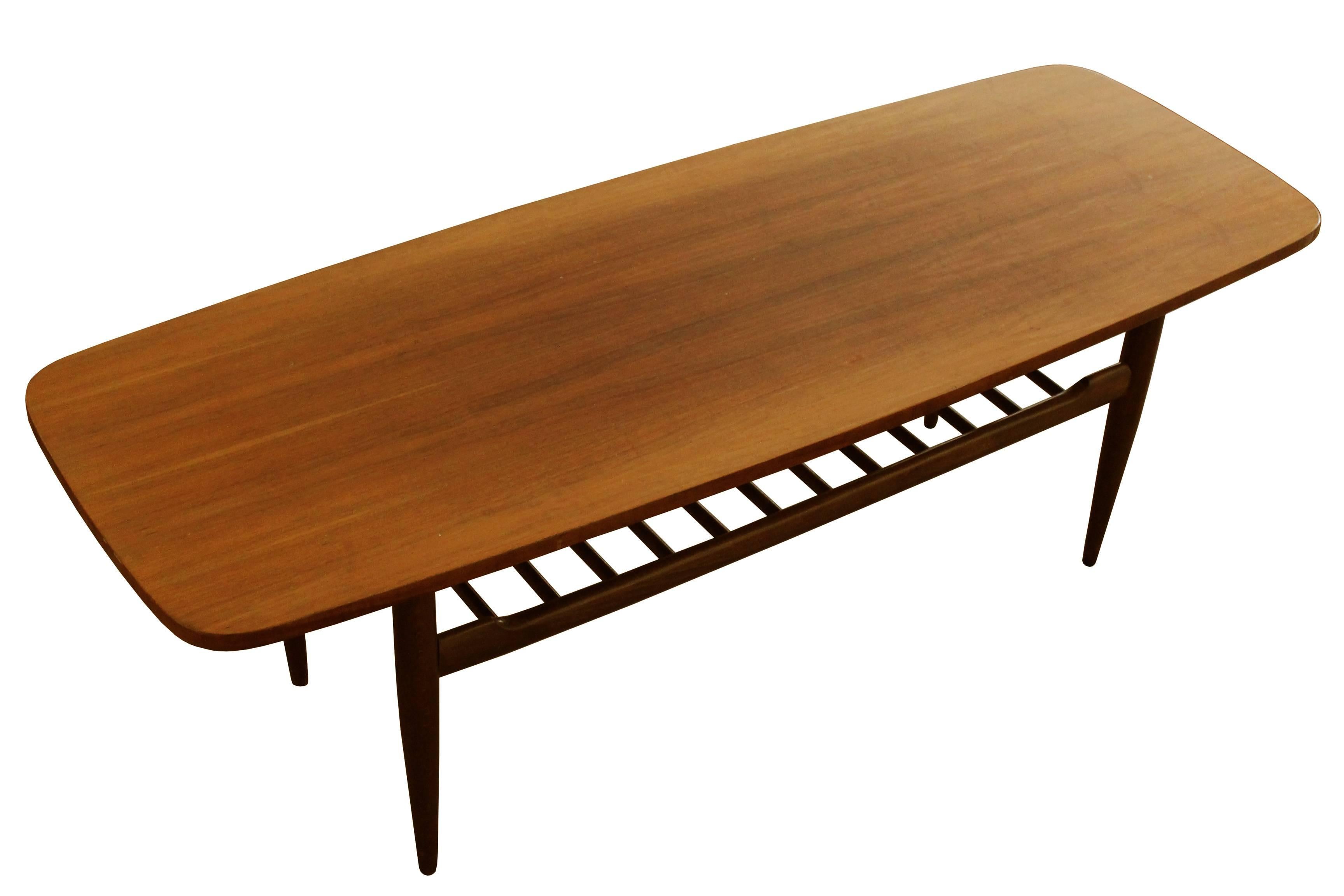 A beautiful coffee table in excellent original condition. This piece was inspired by Scandinavian design, however it was made and produced in former Czechoslovakia. Since its introduction in late 1970s, the table was used in many expensive hotels