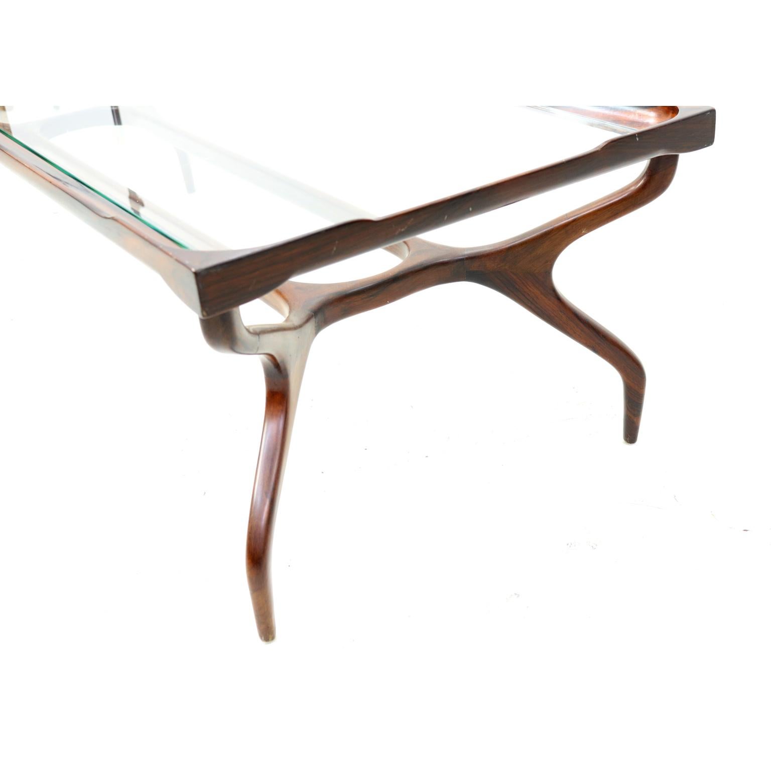 Brazilian midcentury coffee table in jacaranda and glass designed by Giuseppe Scapinelli, 1950s.
 