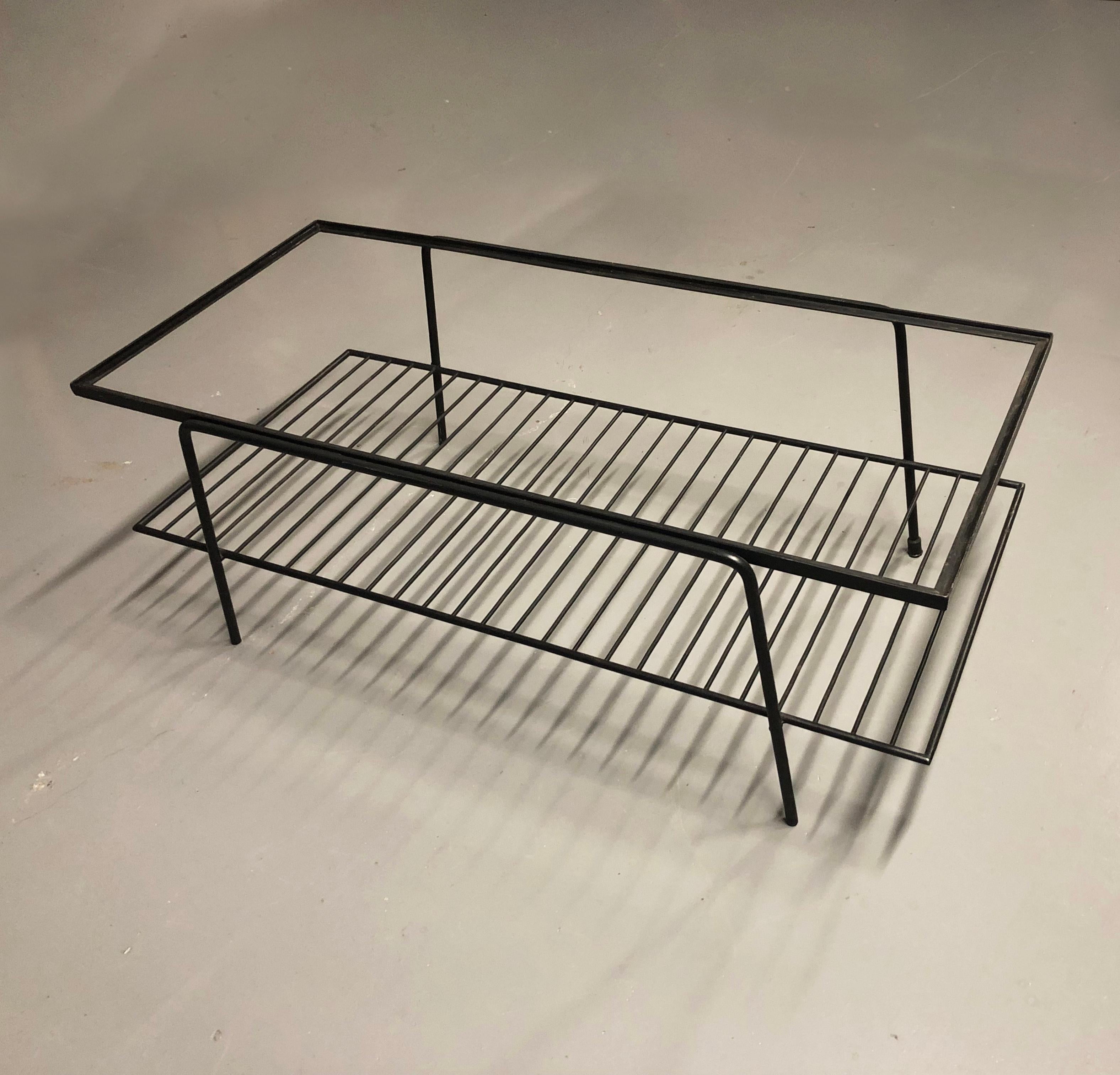 Rectangular midcentury coffee table in black painted solid steel, designed by Carlo Hauner for Forma. Brazil, circa. 1955

This table features the trademark light metal frame we see on many Hauner+Eisler’s designs: a midcentury delight of simplicity
