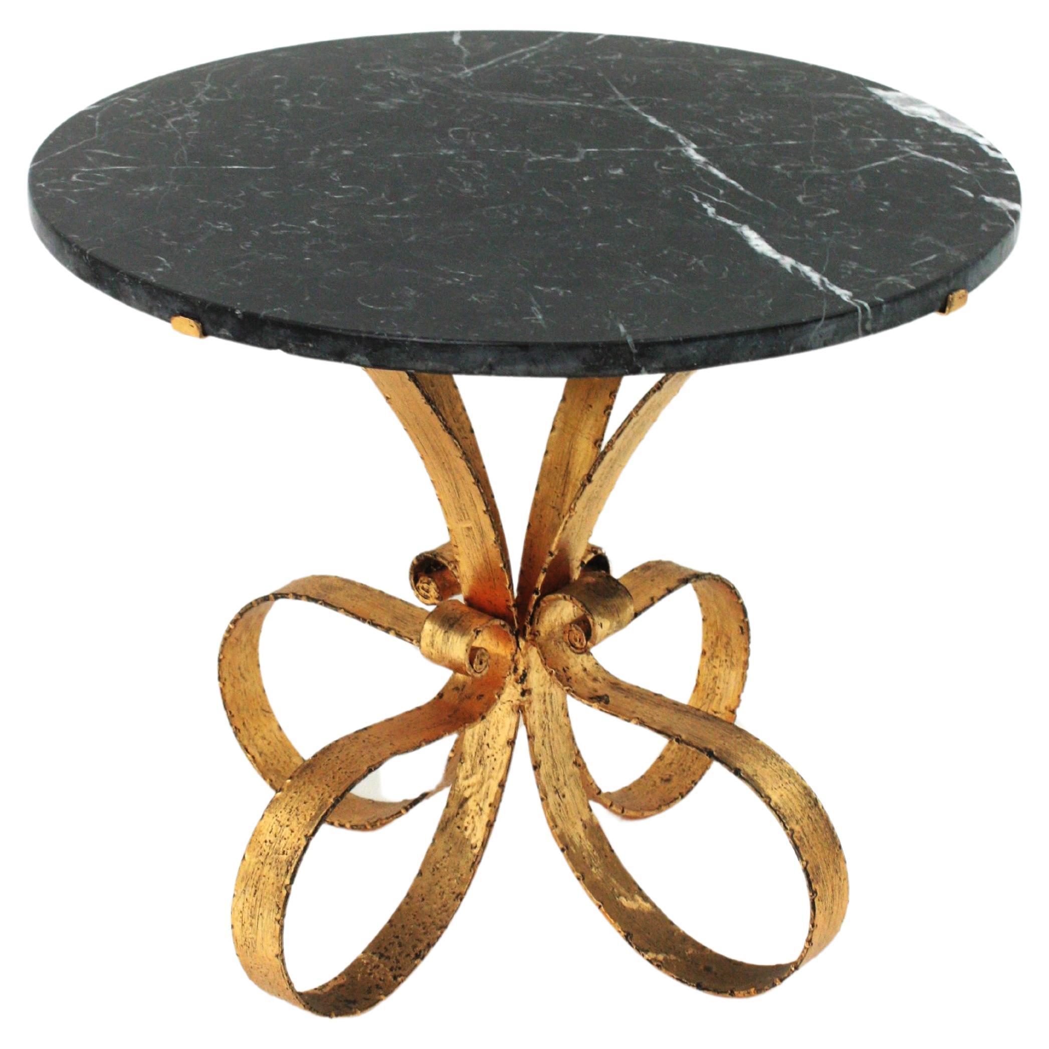 Round Coffee Table in Marble and Wrought Gilt Iron, Spain, 1940s-1950s.
Midcentury Gilt Iron Coffee Table with Black and White Marble Top
____________________________________________________________
Eye-catching gilt wrought iron low table with