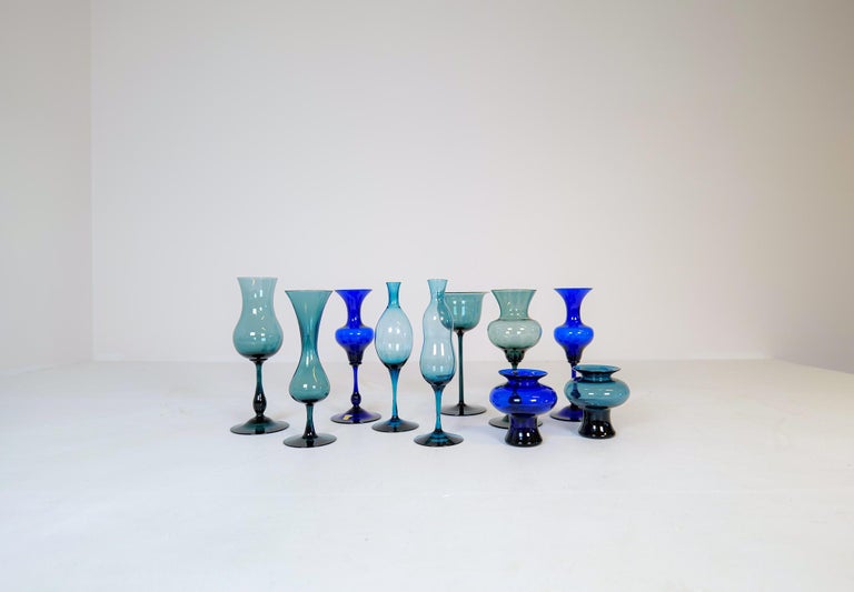This collection of 10 vases were made at Gullaskruf in Sweden 1960s and designed by famous Arthur Percy. Wonderfully sculptured and colored are these vases. Shifting in blue colors and shapes this collection is a great edition to any modern home.