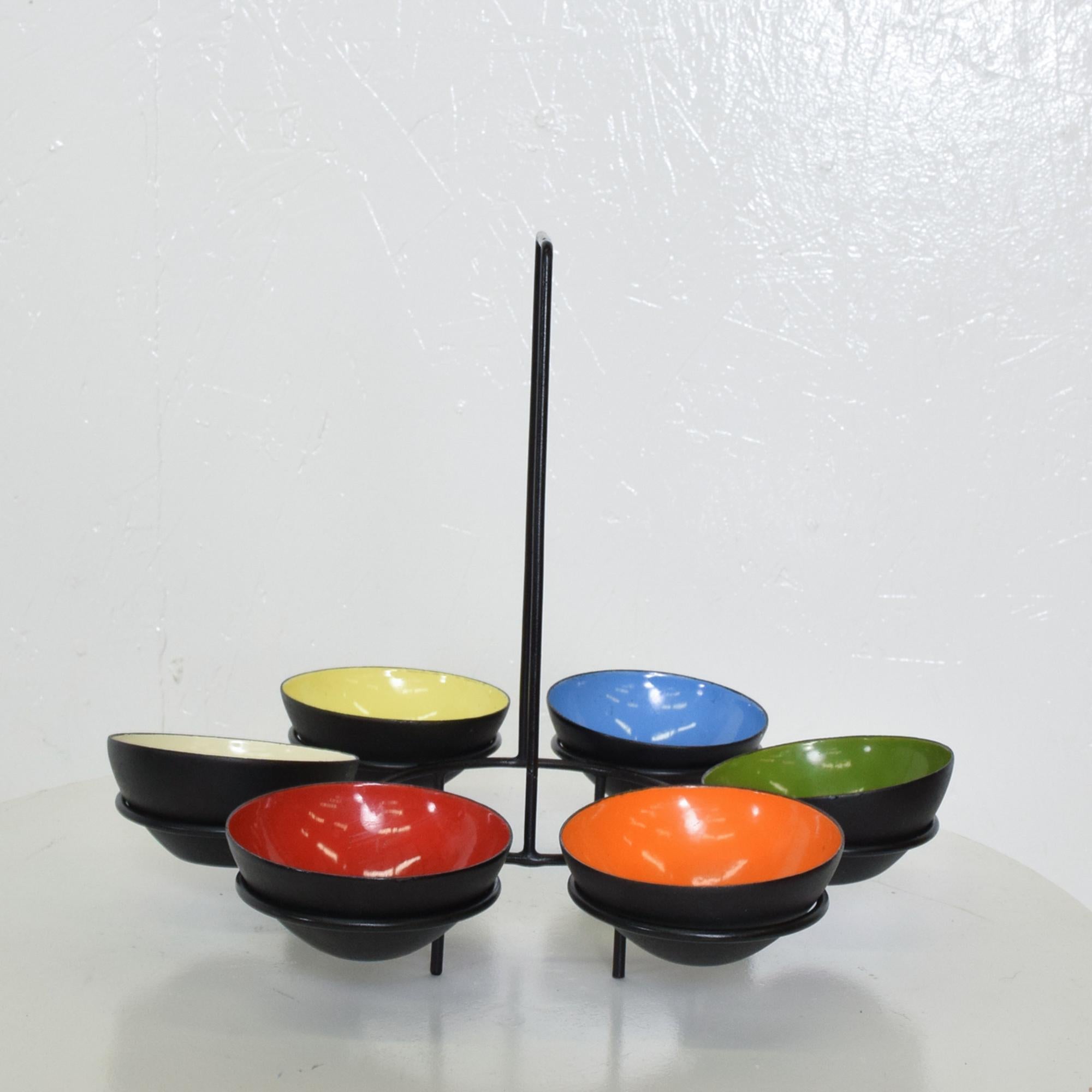AMBIANIC presents
1950s Herbert Krenchel Colorful Enamel Serving Bowls Set of Six Denmark.
No label remains. Ghost label visible on one bowl.
Copper enamel and iron.
Extraordinary 1954 design Krenit bowls
10 H x 12 in diameter, Bowl 3.5 diameter x