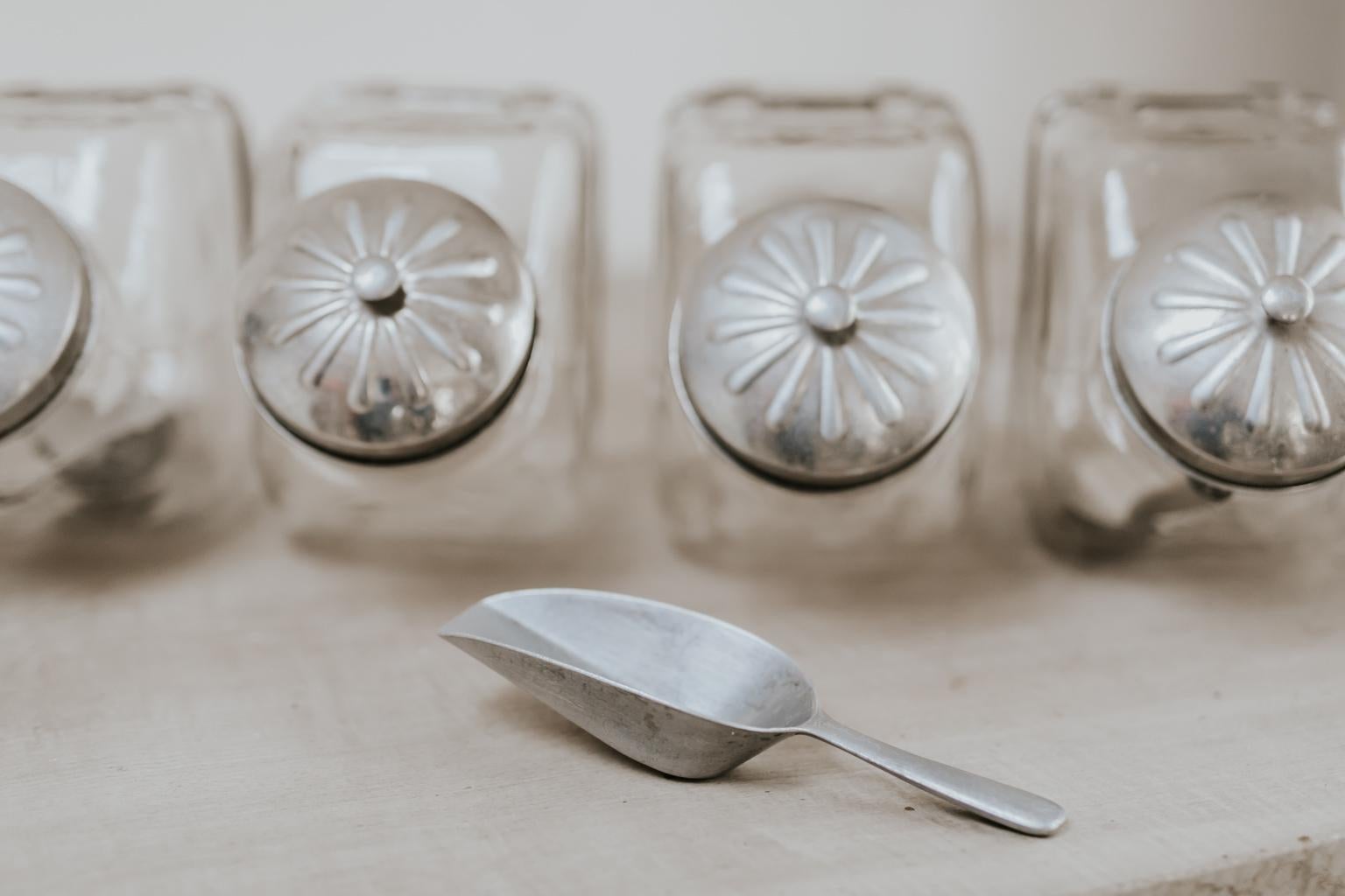 These glass jars were used to hold candy/sweets in candyshops mid-20th century,
they all have their original lid and 3 spoons, wonderful decorative item in every kitchen, great
to store, pasta, rice, seeds and sweets of course.
 
