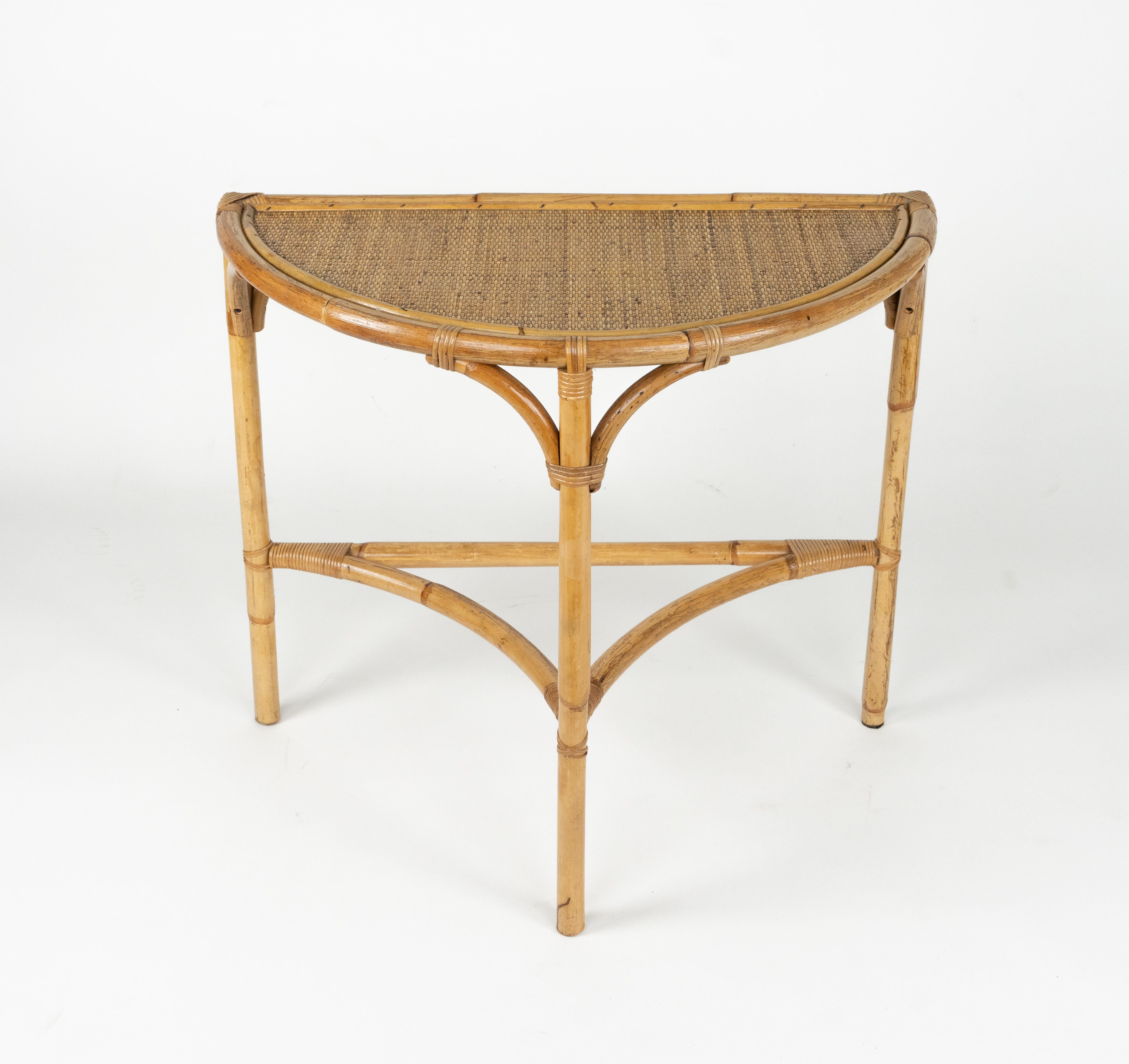 Midcentury beautiful demilune console table in rattan and bamboo in the style of Franco Albini.  

Made in Italy in the 1970s.