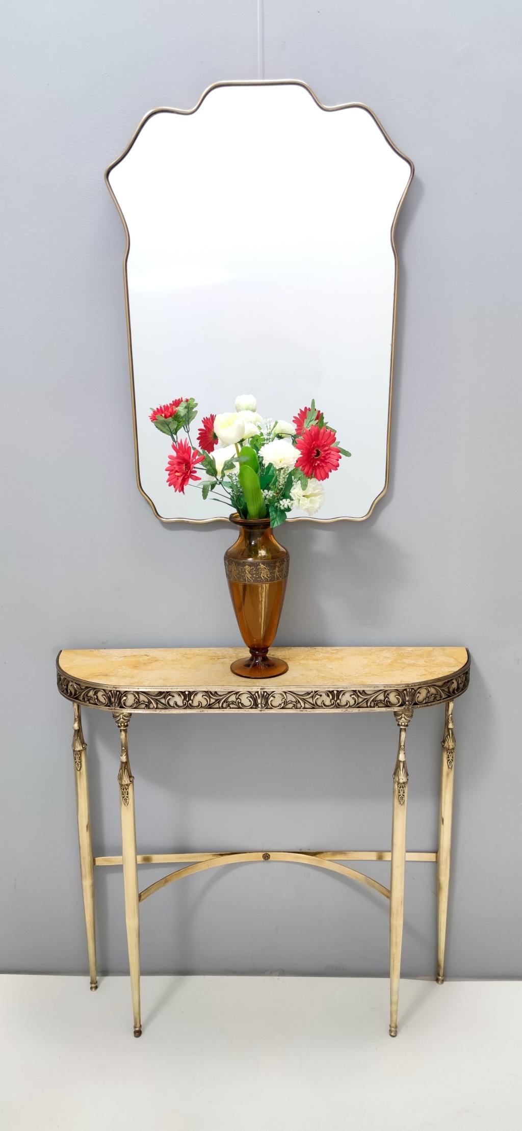 Made in Italy, 1950s.
This console table features a 4.7- centimeter thick royal yellow marble top and a brass frame. 
It is a vintage item, therefore it might show slight traces of use, but it can be considered as in excellent original condition