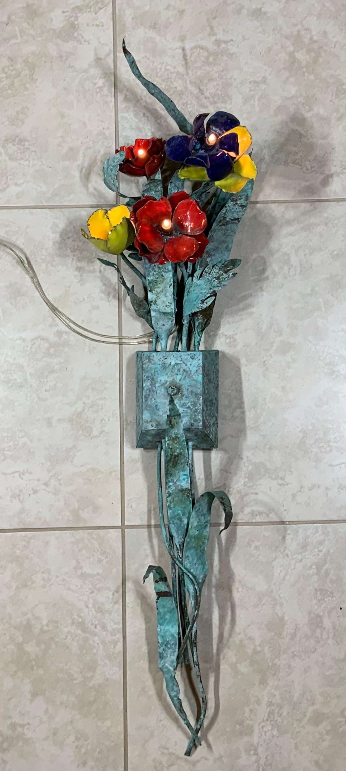 Midcentury pair of wall sculptural wall sconces Artistically handcrafted in copper with a vertigree patina featuring with enamel flowers , withe small size light on each flower.
Beautiful pair for any wall.

 